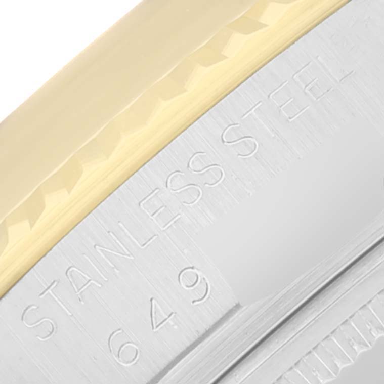 This close-up image of the Rolex Vintage Collection 16013 Men's Steel and Gold (two tone) Black Dial 16013 Men's Steel and Gold (two tone) Black Dial watch shows the edge of the bezel and part of the stainless steel casing.