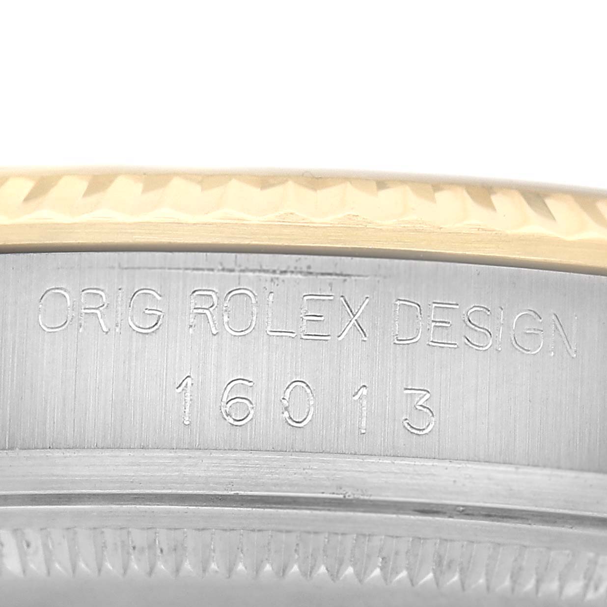 The image shows a close-up side view of the model number engraving on the case of a Rolex Datejust 16013 Men's Steel and Gold (two tone) Champagne Dial watch.