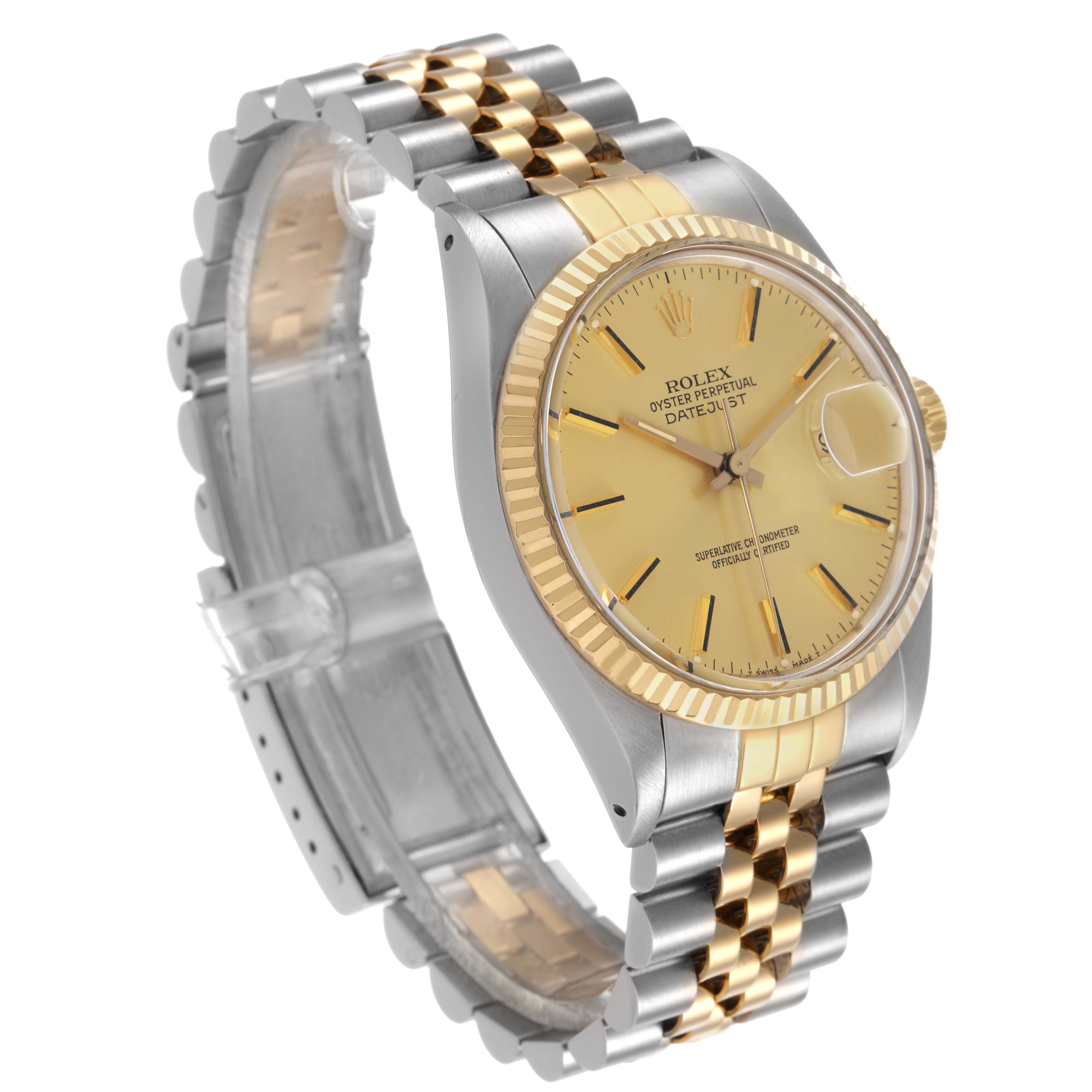 The image shows a Rolex Datejust 16013 Men's Steel and Gold (two tone) Champagne Dial watch at a slight angle, highlighting the bezel, dial, and two-tone bracelet.