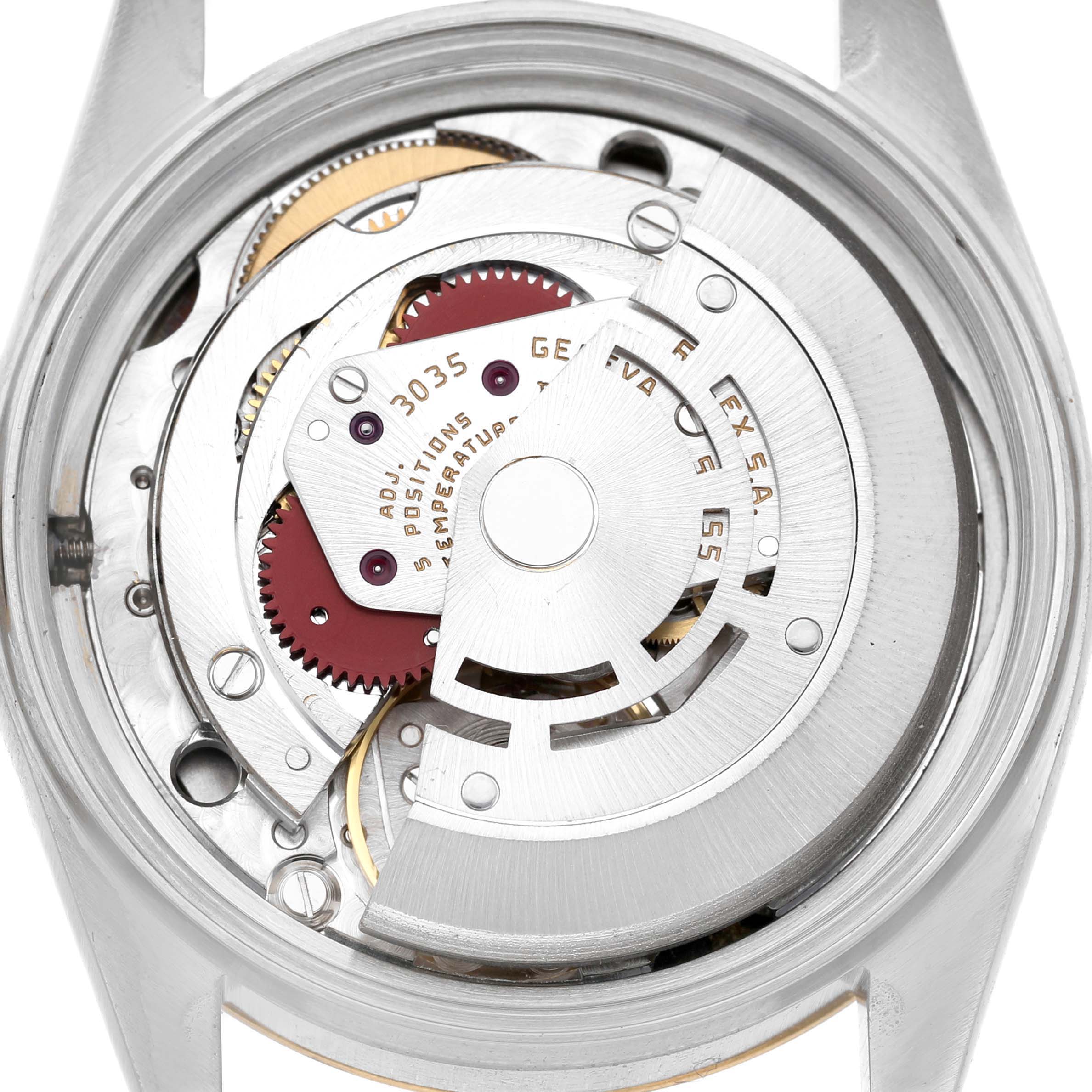 The image shows the movement of a Rolex Datejust 16013 Men's Steel and Gold (two tone) Champagne Dial watch viewed from the back, highlighting its intricate mechanical components.