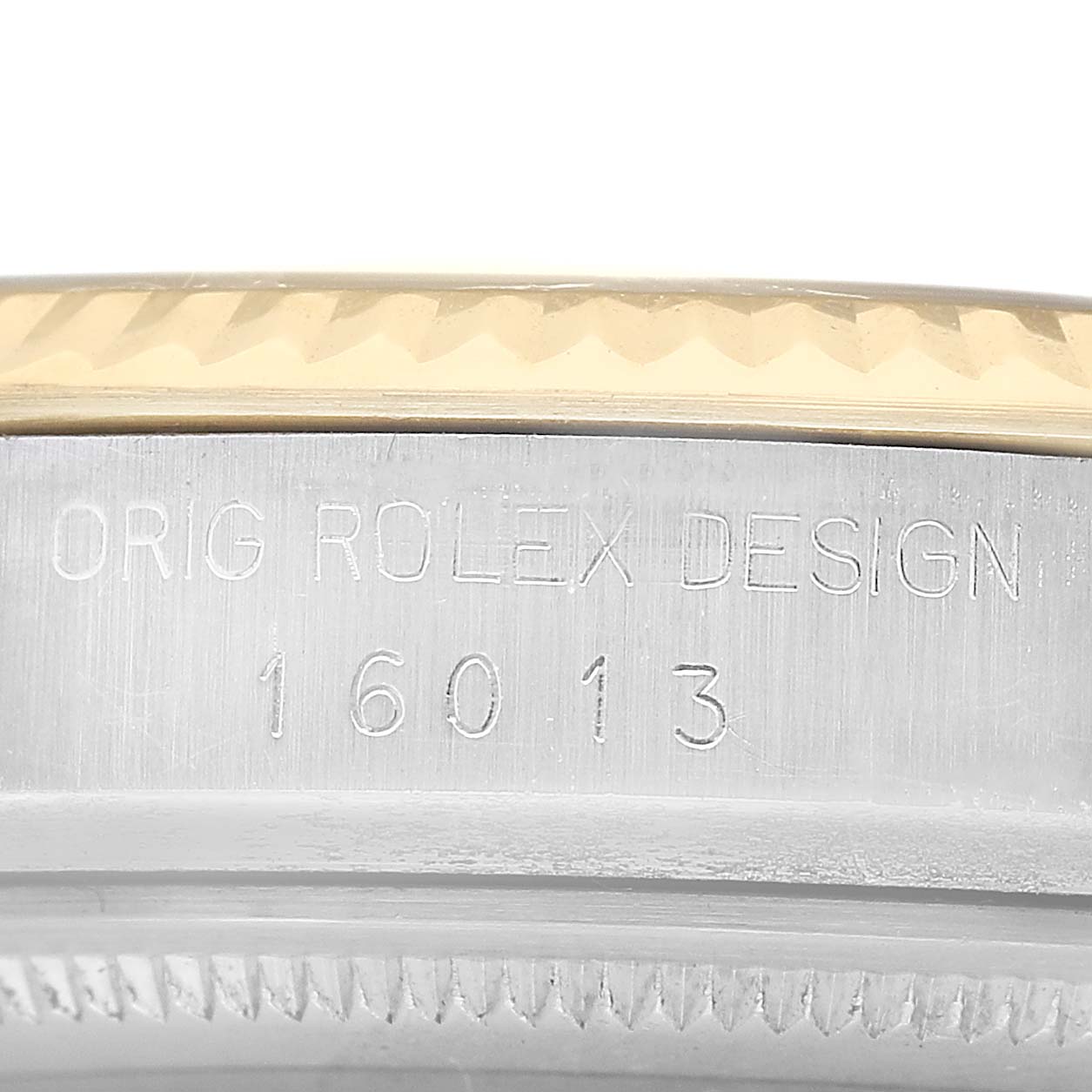 The image shows the side view of a Rolex Datejust 16013 Men's Steel and Gold (two tone) Champagne Dial, featuring the engraved model number and bezel details.