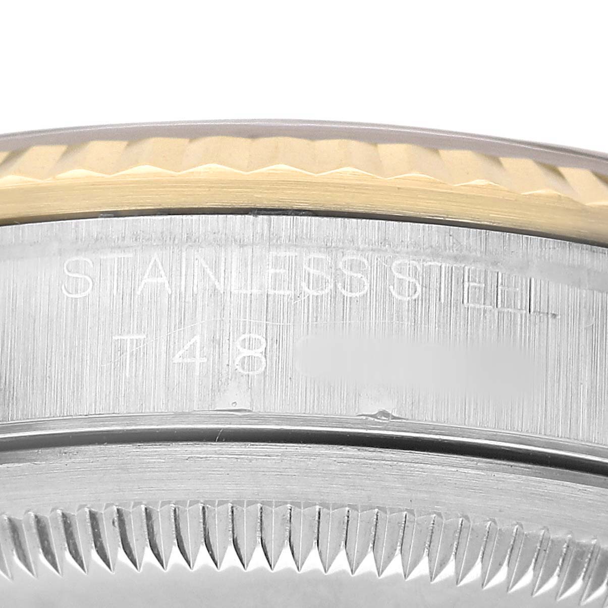 The image shows a close-up of the side of a Rolex Datejust 16233 Men's Steel and Gold (two tone) White Dial watch, highlighting the stainless steel part and the bezel.