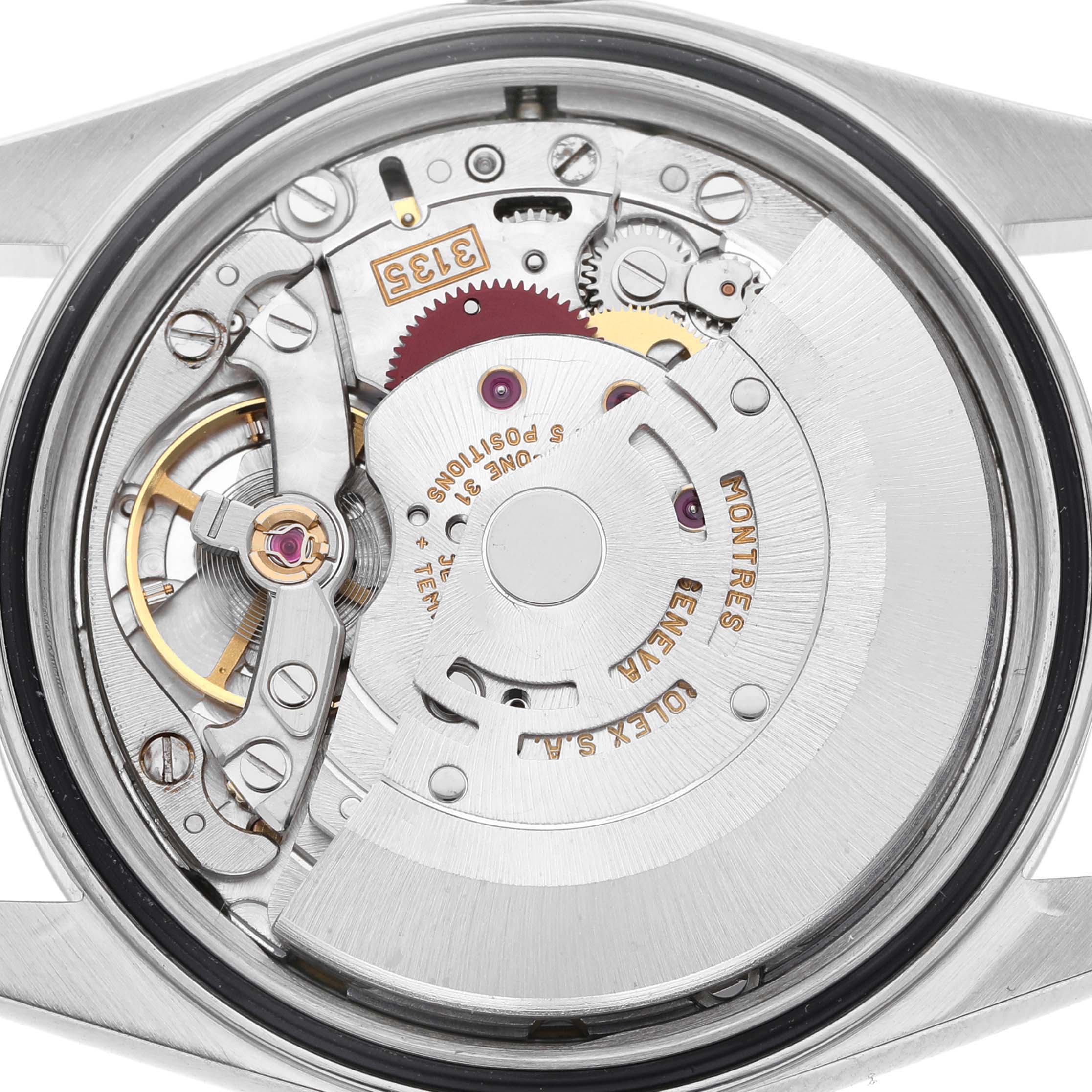 The image shows the internal movement mechanism of a Rolex Datejust 16233 Men's Steel and Gold (two tone) White Dial watch from the back angle.