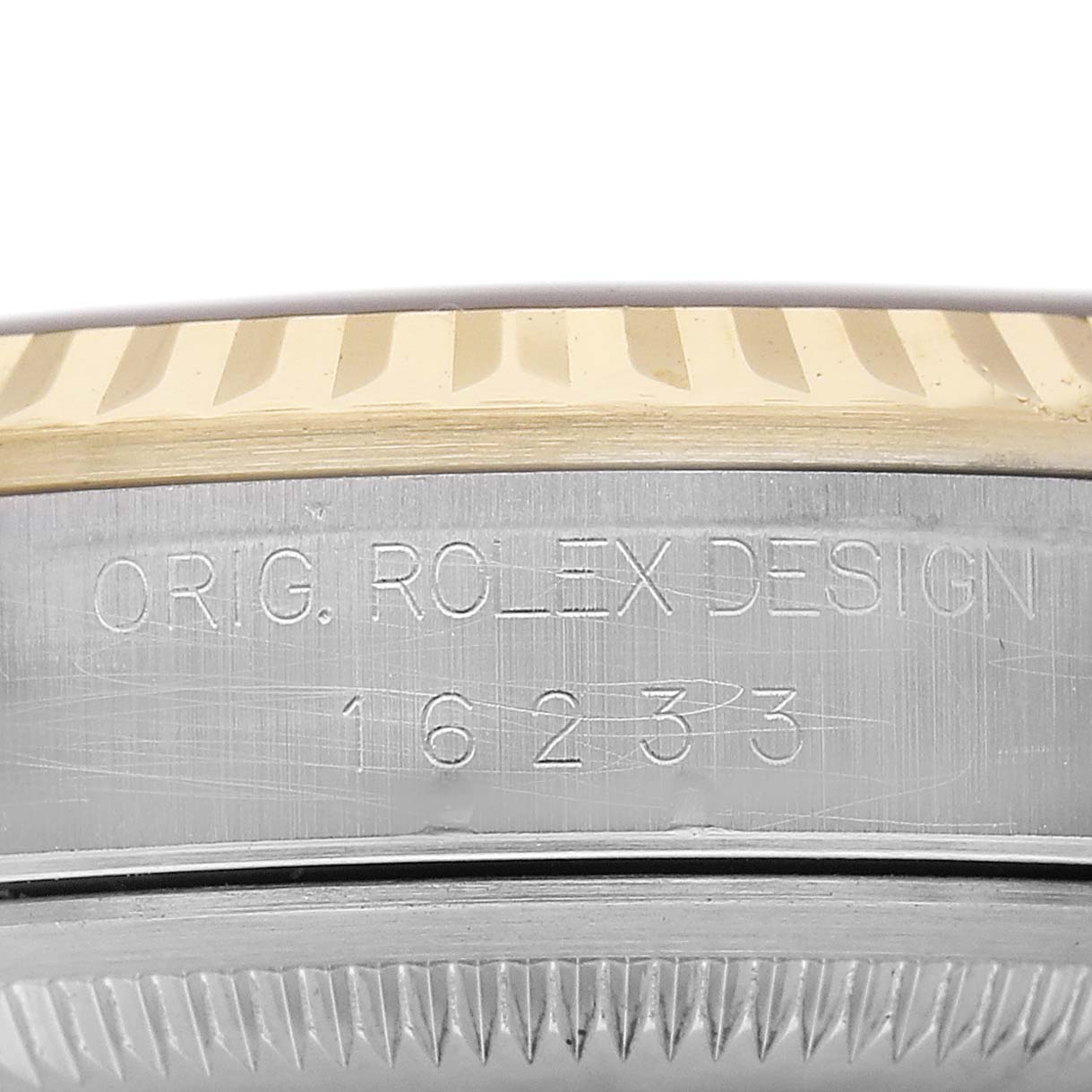 The image shows the side view of a Rolex Datejust 16233 Men's Steel and Gold (two tone) White Dial with engraved model number and fluted bezel details.