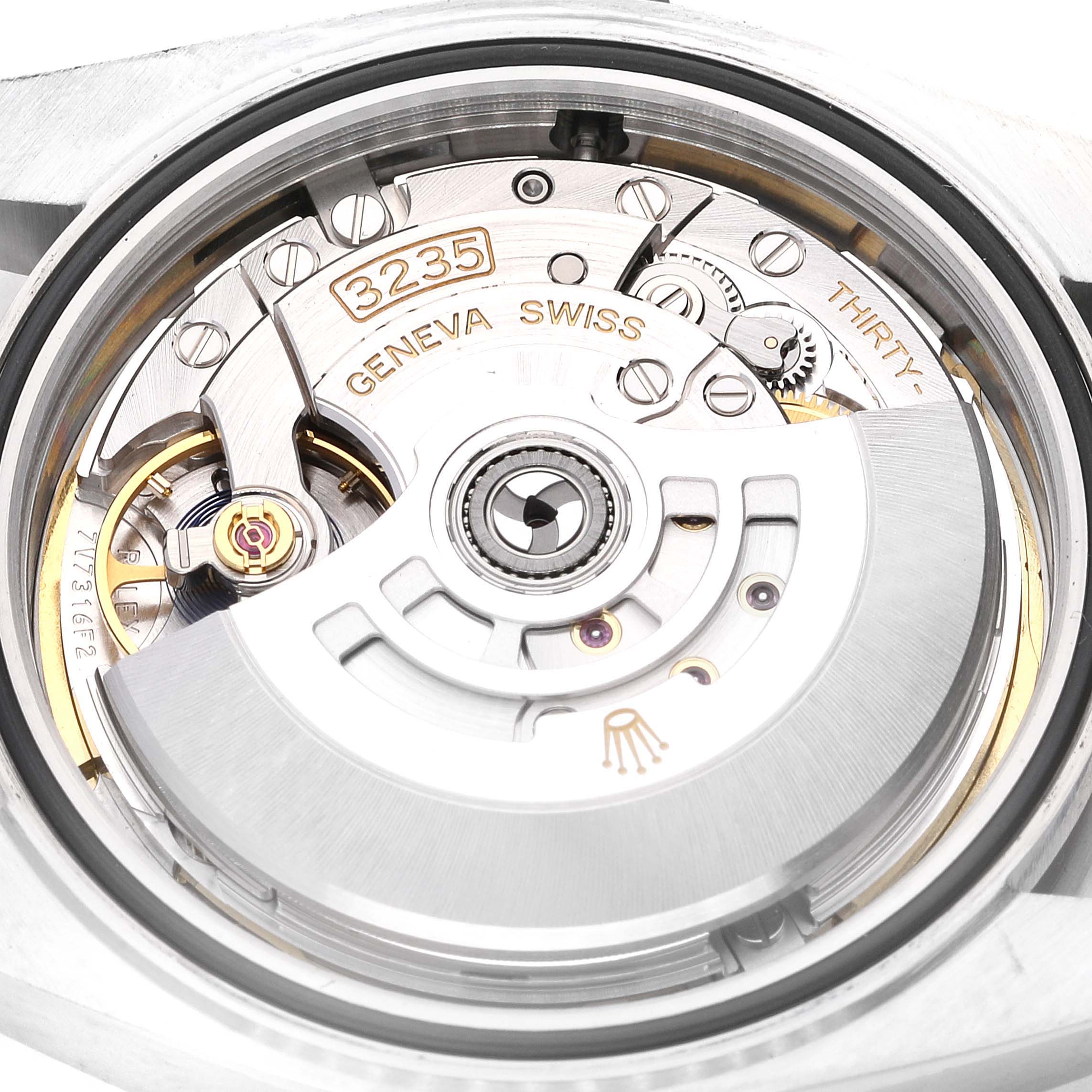 This image shows the movement mechanism of a Rolex Datejust 41 126300 Men's Stainless Steel Blue Dial 126300 Men's Stainless Steel Blue Dial watch from a close-up, angled view, revealing its intricate internal components.