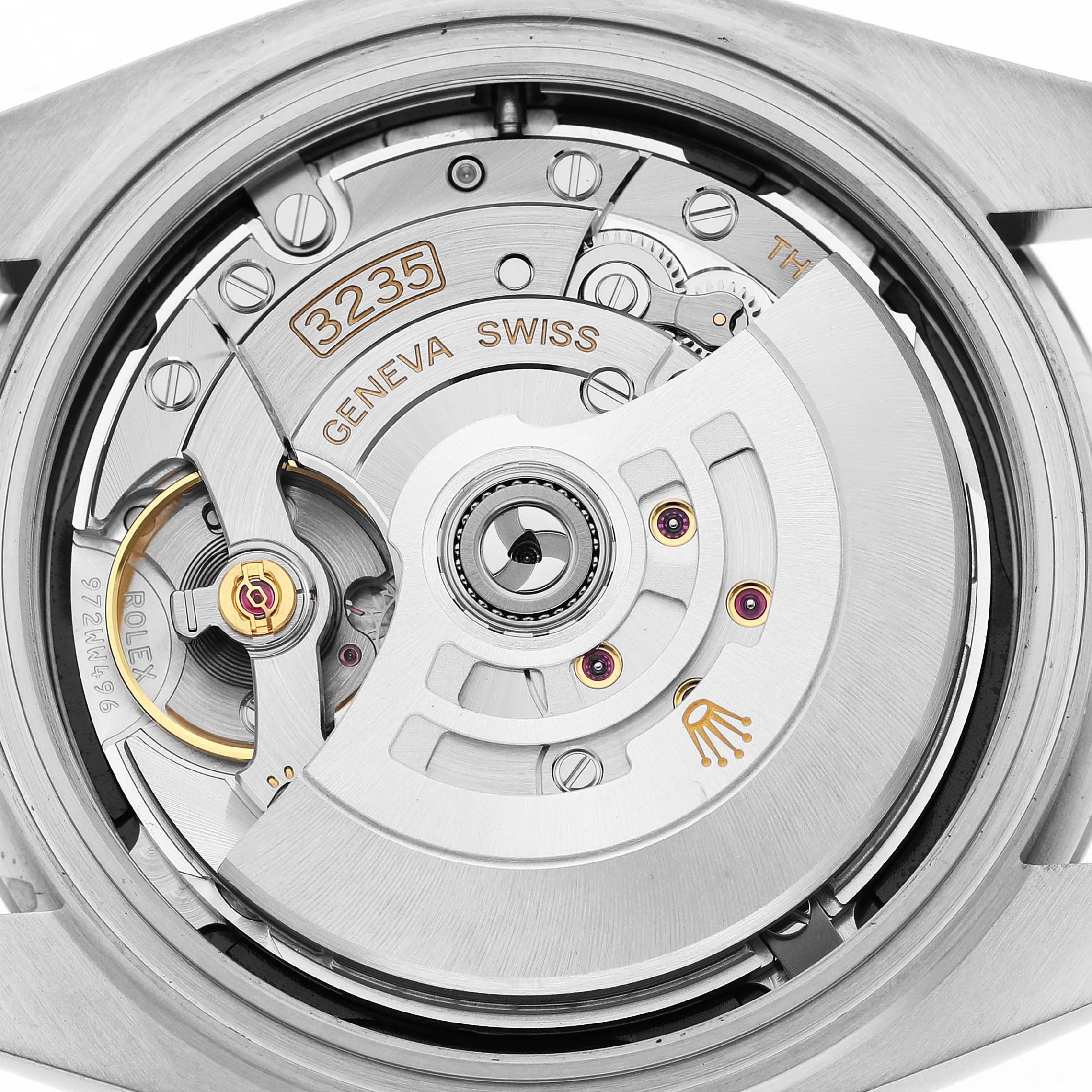 The image shows the movement of a Rolex Datejust 41 126300 Men's Stainless Steel Black Dial, highlighting the rotor and internal components from a back angle.