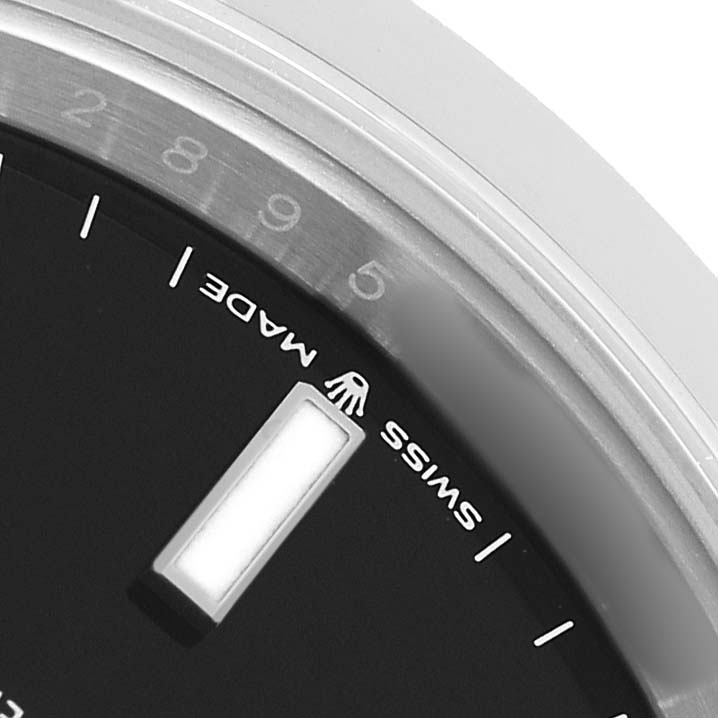 The image shows a close-up of the dial edge and indices of a Rolex Datejust 41 126300 Men's Stainless Steel Black Dial, focusing on the "Swiss Made" text.