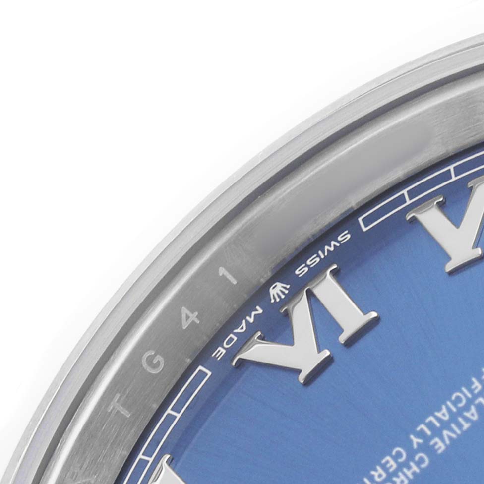 The image shows a partial close-up of the dial and bezel of a Rolex Datejust 41 126300 Men's Stainless Steel Blue Dial, highlighting the blue dial and Roman numerals.