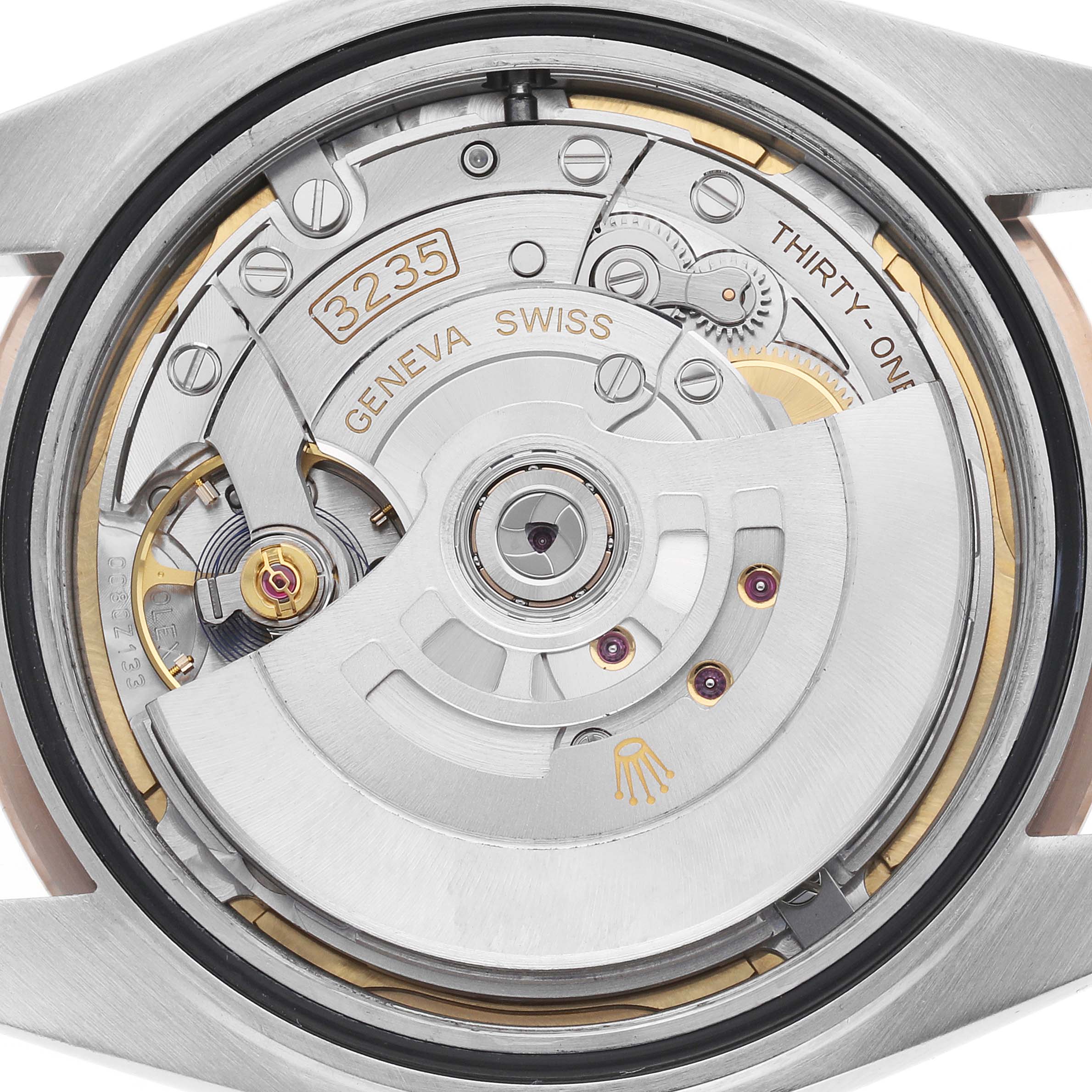 The image shows the back view of the Rolex Datejust 41 126301 Men
s Steel and Gold (two tone) Mother of Pearl Dial, highlighting the intricate movement and rotor mechanism.