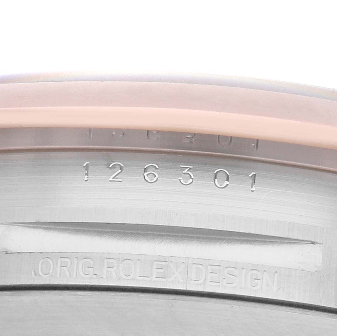 The image shows a close-up of the bezel and inner rim of a Rolex Datejust 41 126301 Men
s Steel and Gold (two tone) Mother of Pearl Dial, displaying the model number and "ORIG ROLEX DESIGN."