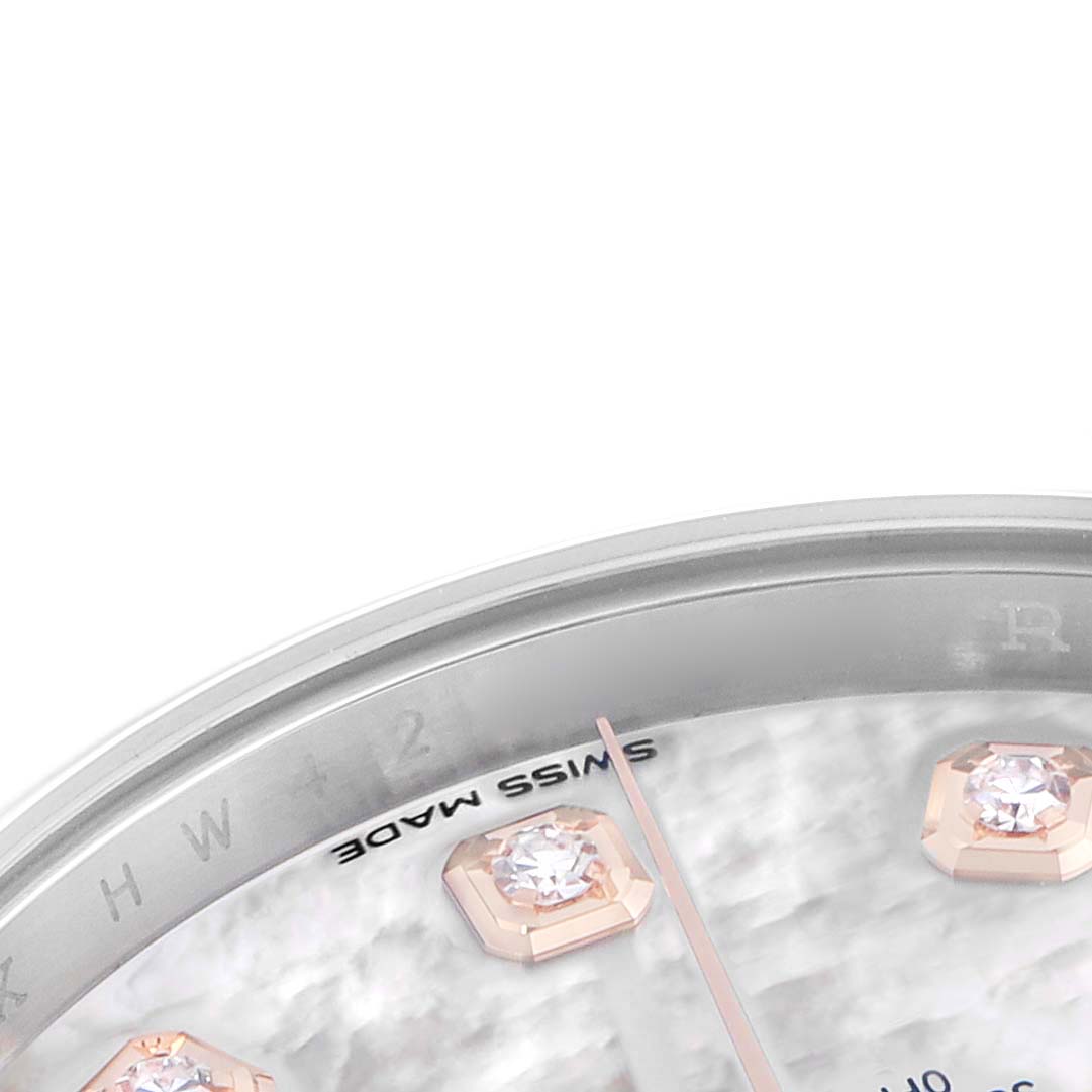 The image shows a close-up of the dial of a Rolex Datejust 41 126301 Men's Steel and Gold (two tone) Mother of Pearl Dial, highlighting diamond hour markers and partial hands.