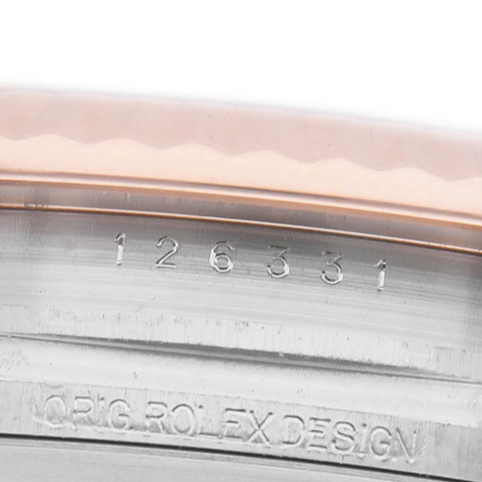 The image shows an engraved case side of a Rolex Datejust 126331 Men's Steel and Gold (two tone) Pink Dial, displaying its model number.