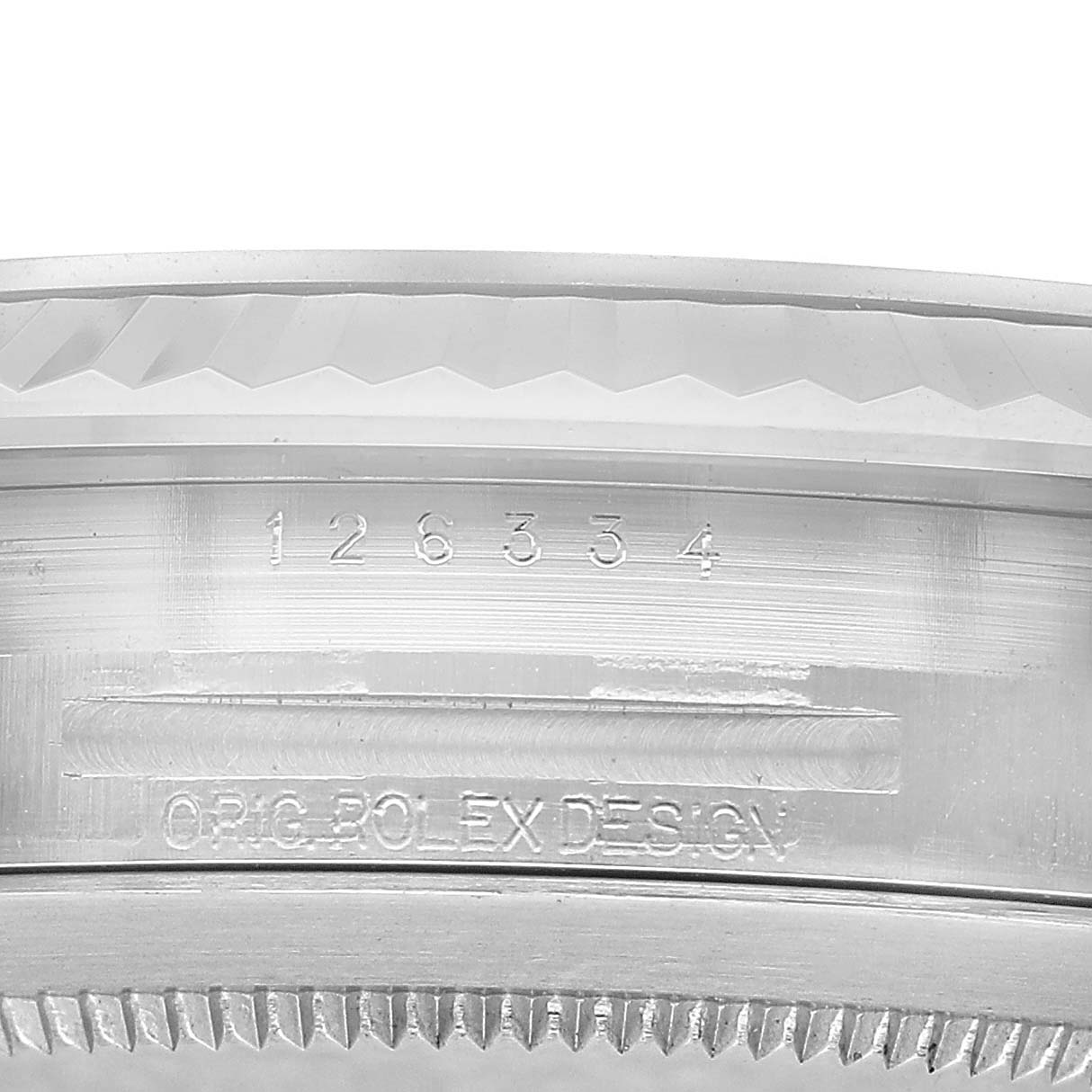 The image shows a close-up of the side of the bezel and case of a Rolex Datejust 41 126334 Men's Stainless Steel Blue Dial, featuring model markings.