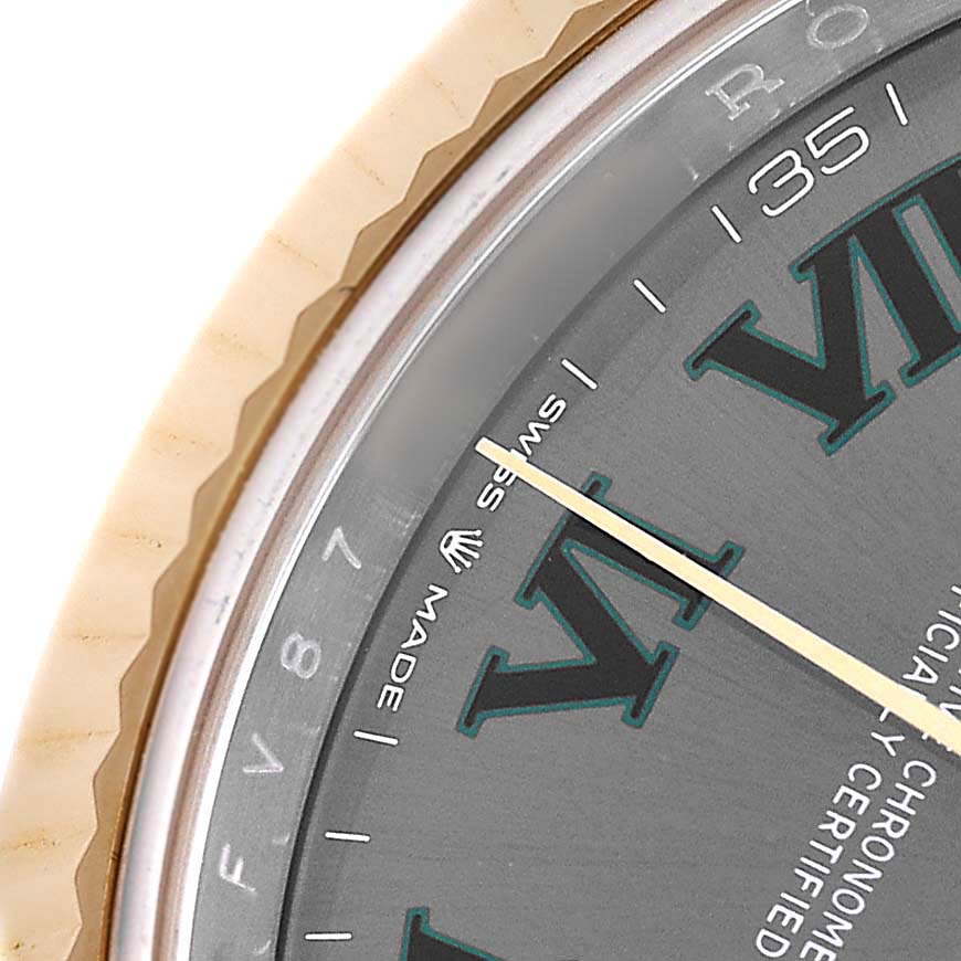 The image shows a close-up of the Rolex Datejust 41 126333 Men's Steel and Gold (two tone) Grey Dial, highlighting the bezel, partial dial, and hands.