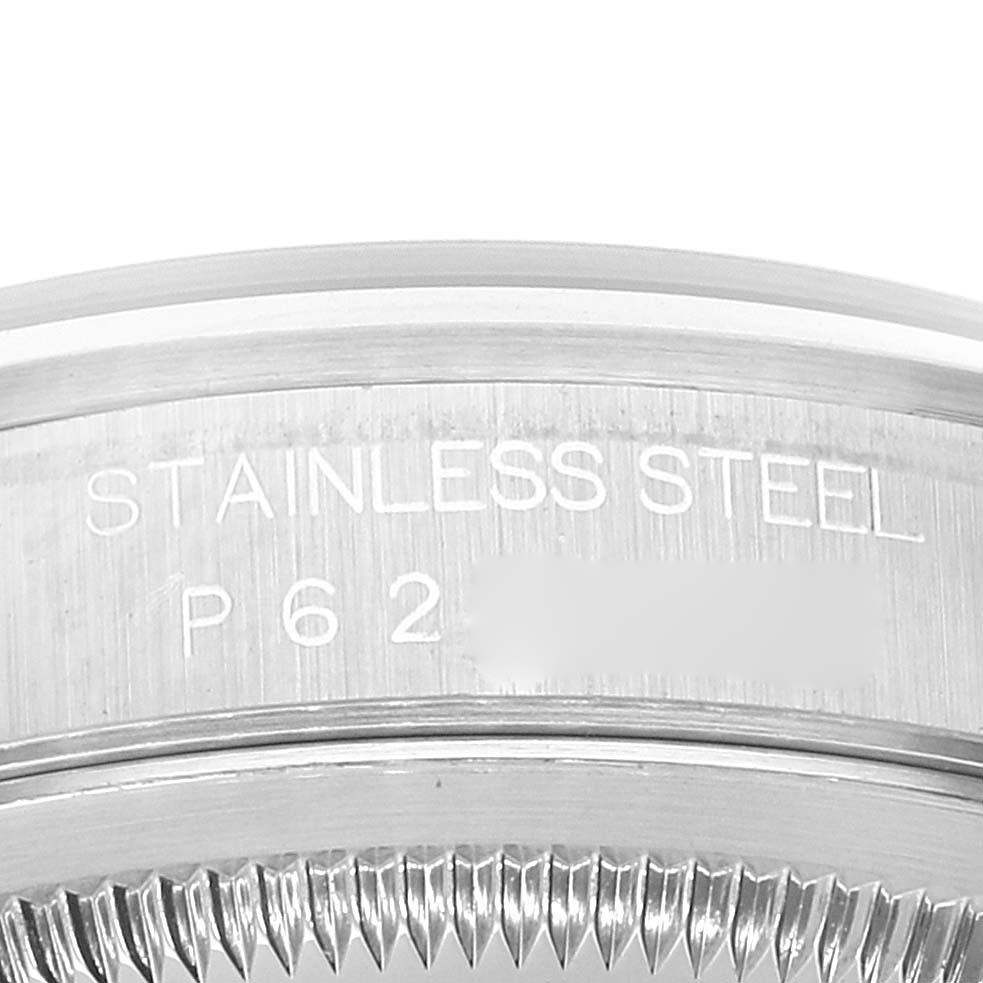 The image shows a close-up view of the stainless steel bezel and part of the serial number on a Rolex Datejust 16200 Men's Stainless Steel Black Dial 16200 Men's Stainless Steel Black Dial watch.
