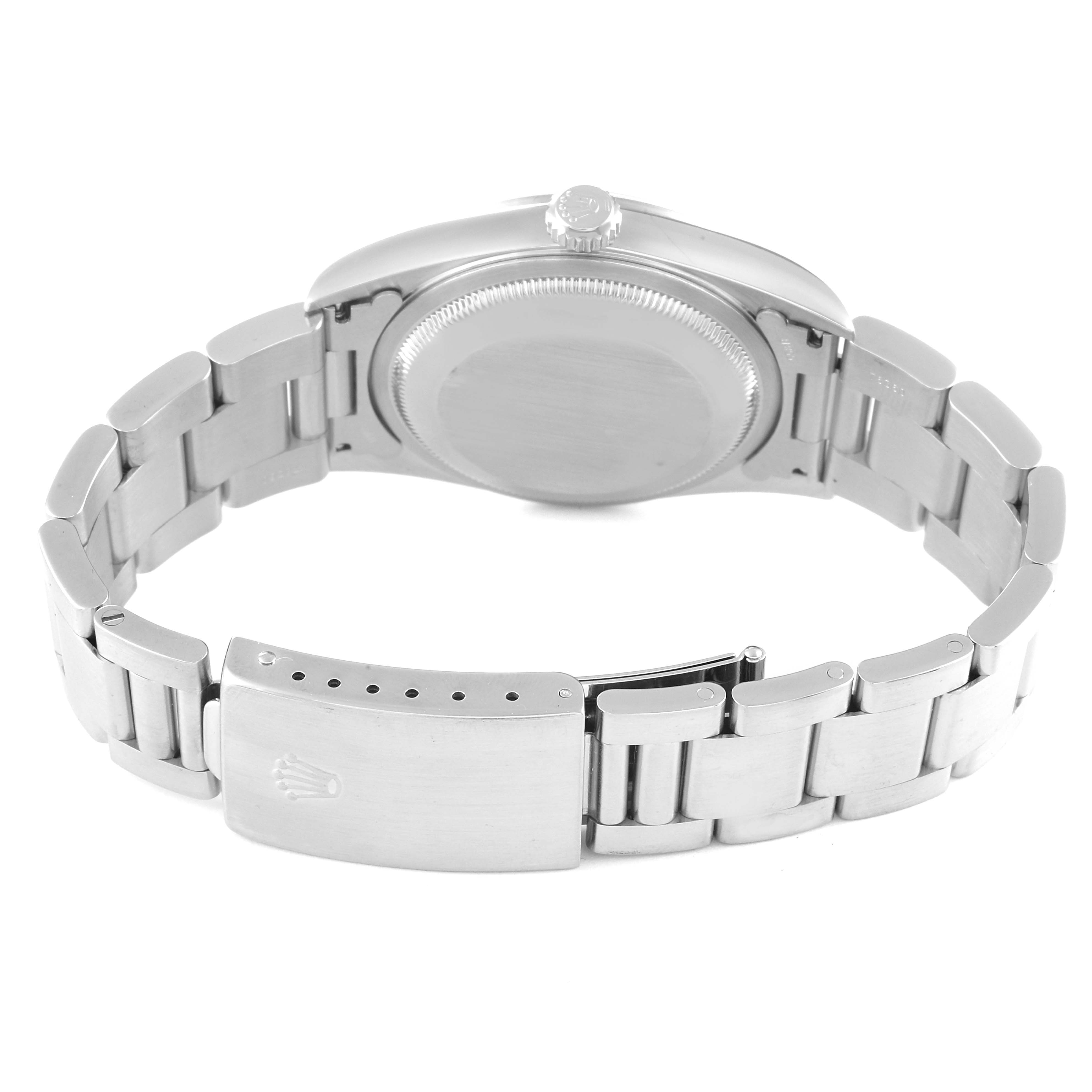 The image shows the back view of a Rolex Datejust 16200 Men's Stainless Steel Black Dial 16200 Men's Stainless Steel Black Dial watch, highlighting the case back and partially opened bracelet clasp.