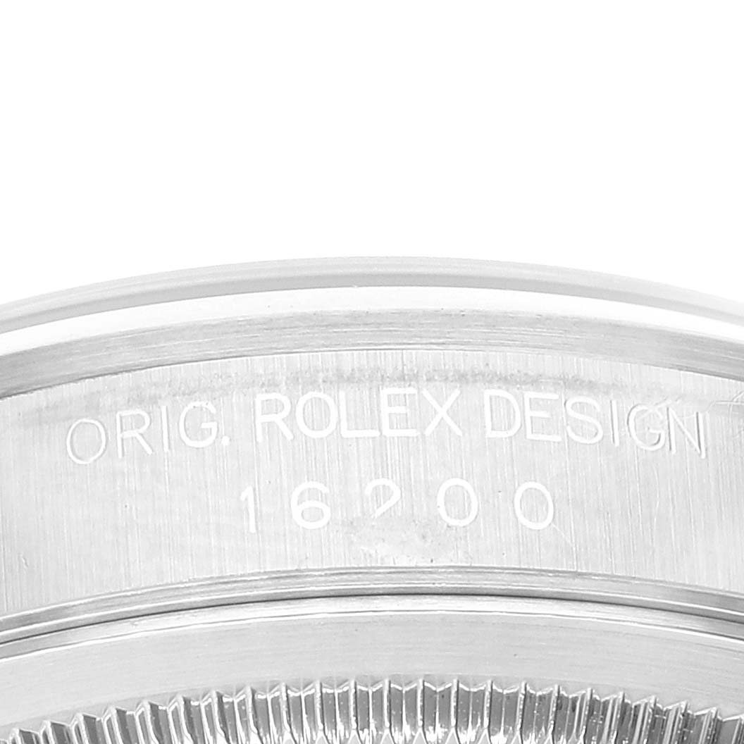 This image shows a close-up of the engraved bezel and case of a Rolex Datejust 16200 Men's Stainless Steel Black Dial 16200 Men's Stainless Steel Black Dial watch, displaying the model number 16200.