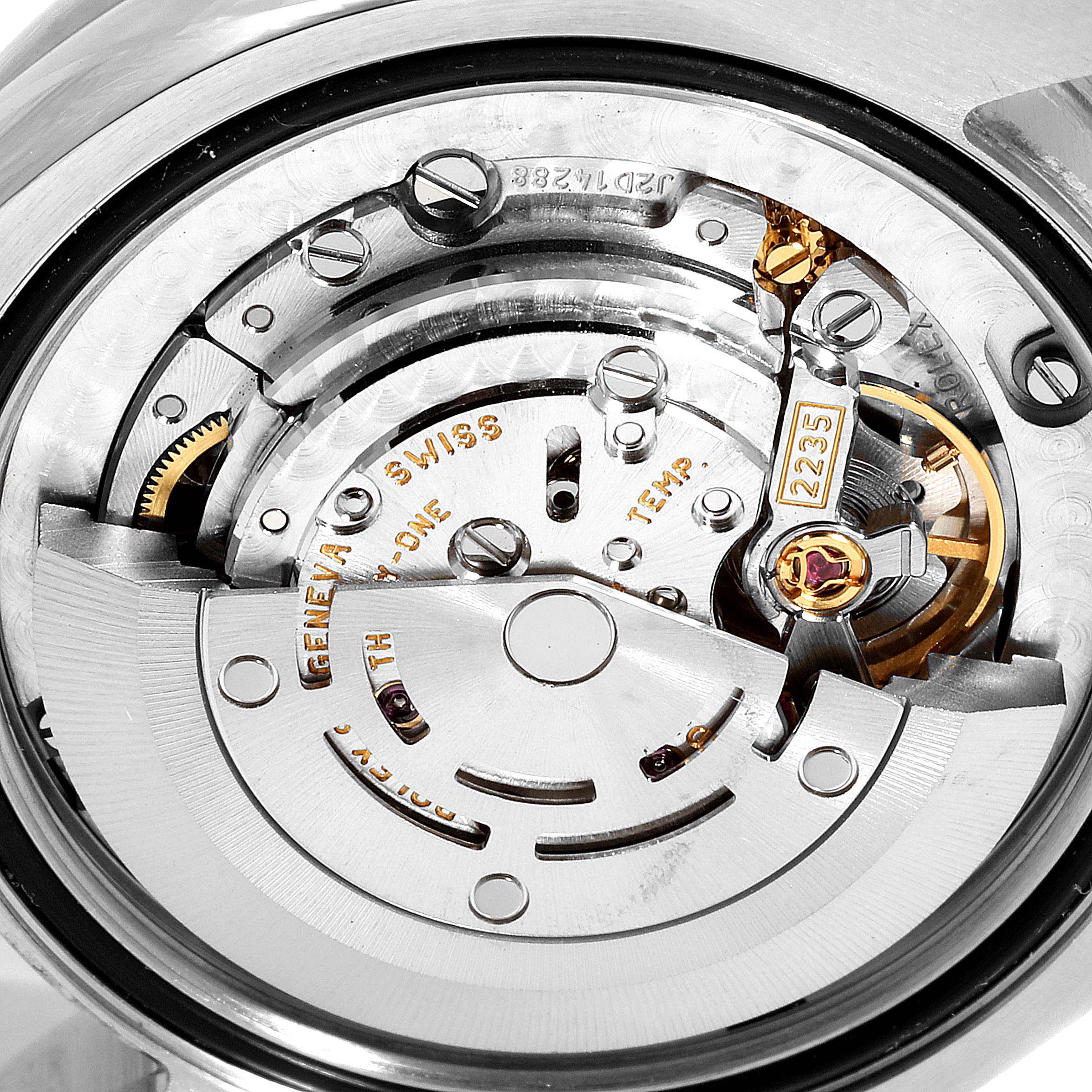 This image shows a close-up view of the internal mechanism of a Rolex Mid-Size 178384 Women
s Stainless Steel Silver Dial 178384 Women
s Stainless Steel Silver Dial watch, highlighting the gears and movement components.
