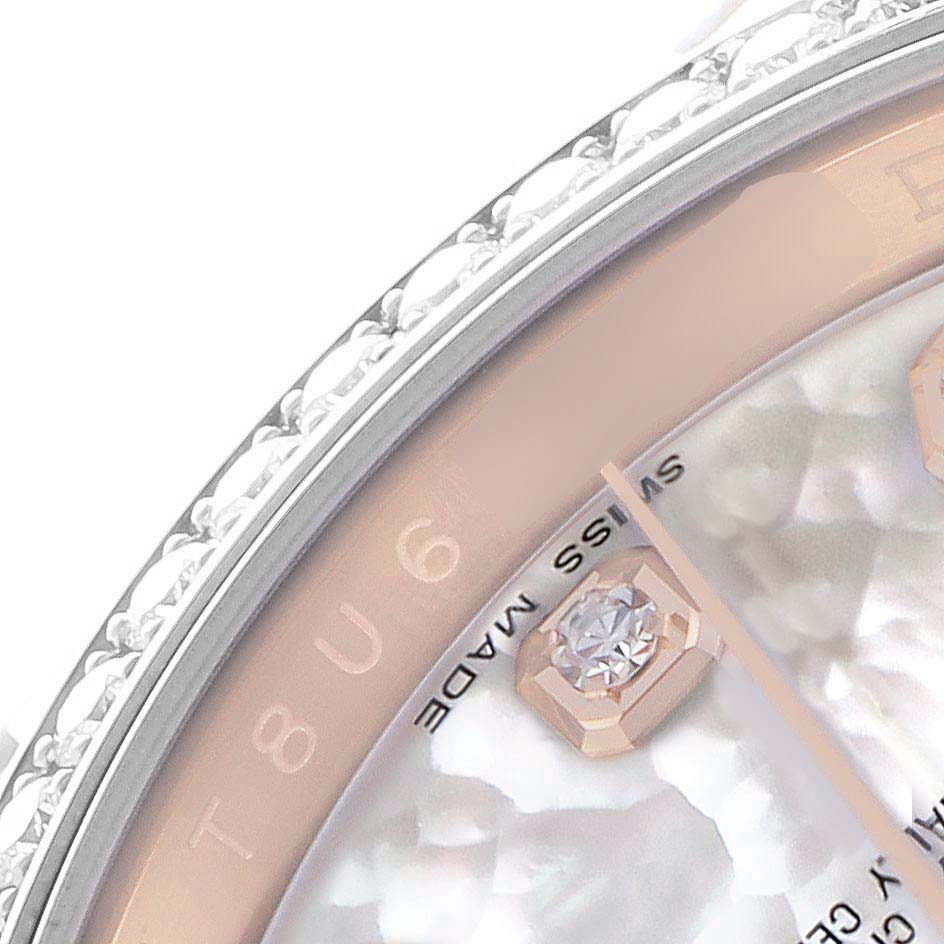 This close-up image of a Rolex Datejust 116185 Men's Rose Gold Mother of Pearl Dial watch shows the bezel, part of the dial, and diamond hour markers at an angled view.