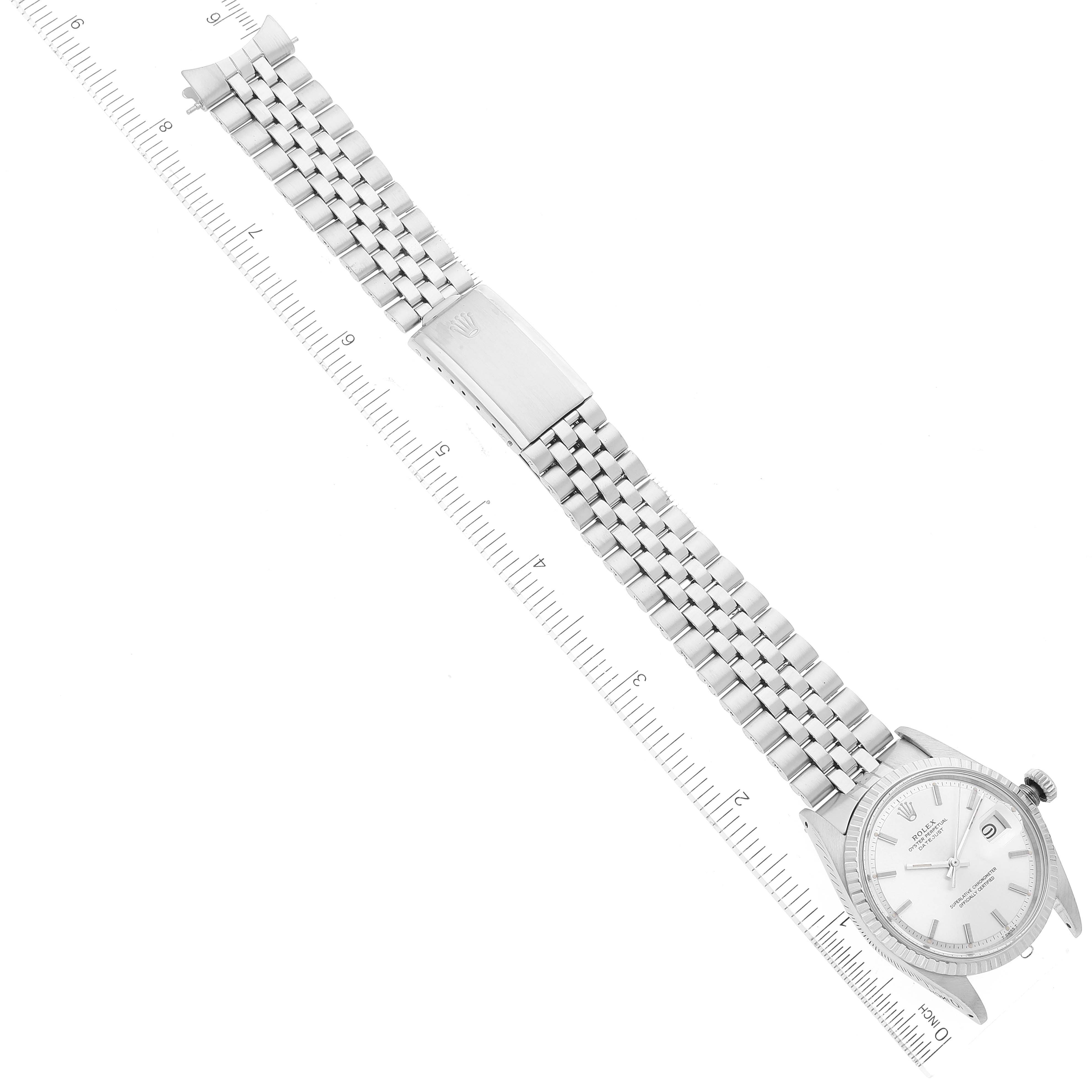 The image shows a Rolex Vintage Collection 1603 Men
s Stainless Steel Silver Dial 1603 Men
s Stainless Steel Silver Dial watch laid flat, featuring the bracelet, clasp, and face at an angled top-down view.