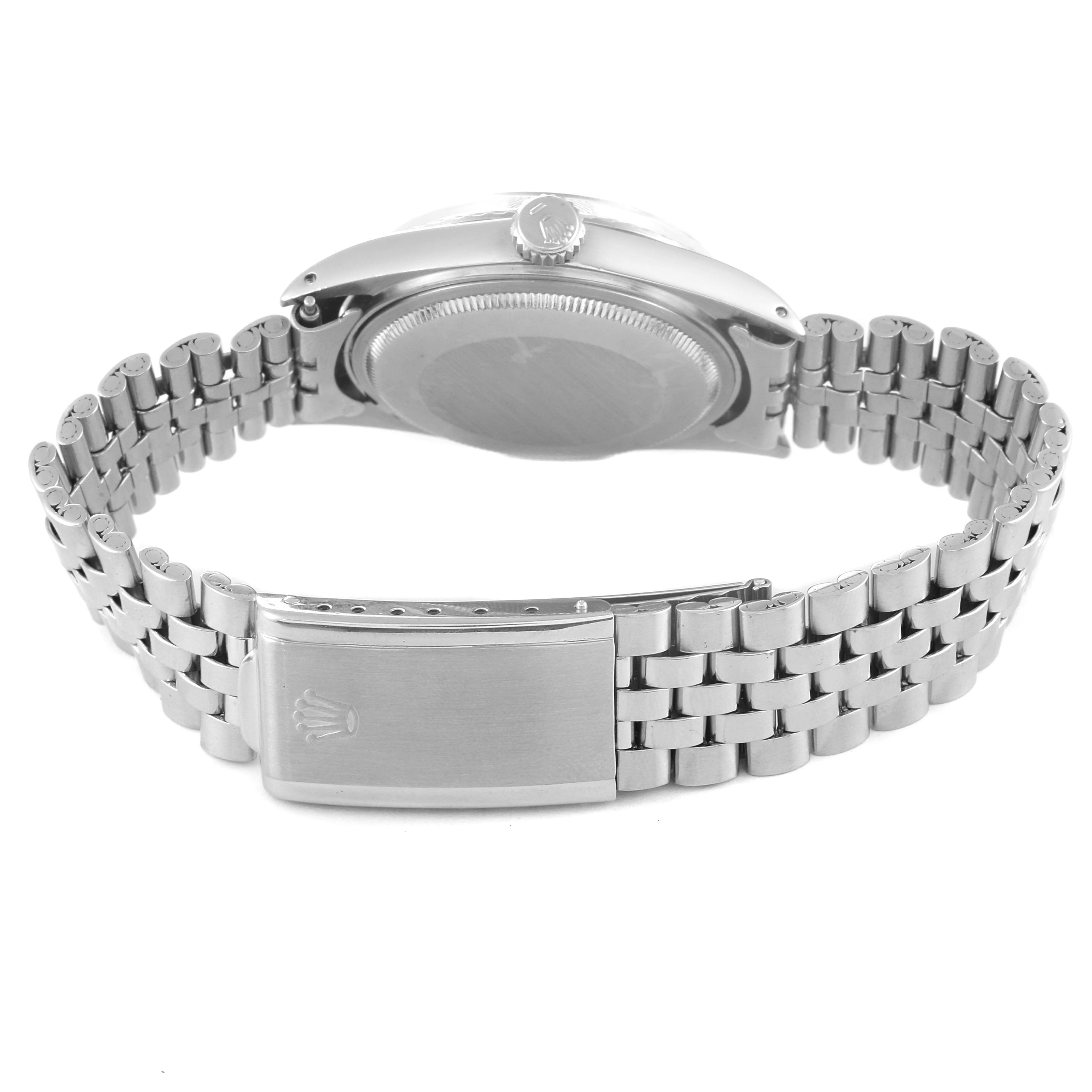 The image shows the back view of a Rolex Vintage Collection 1603 Men
s Stainless Steel Silver Dial 1603 Men
s Stainless Steel Silver Dial watch, focusing on the case back, crown, and bracelet clasp.