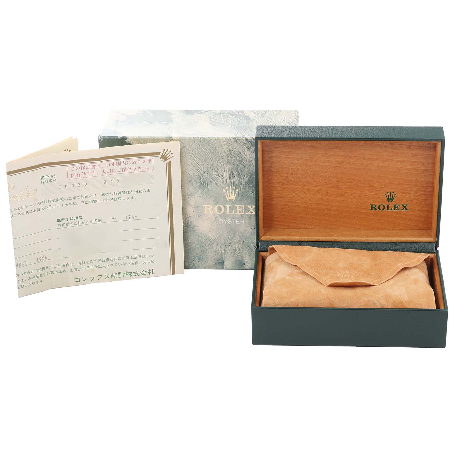 The image shows the packaging, warranty papers, and a watch case for the Rolex Oyster Vintage Collection model.