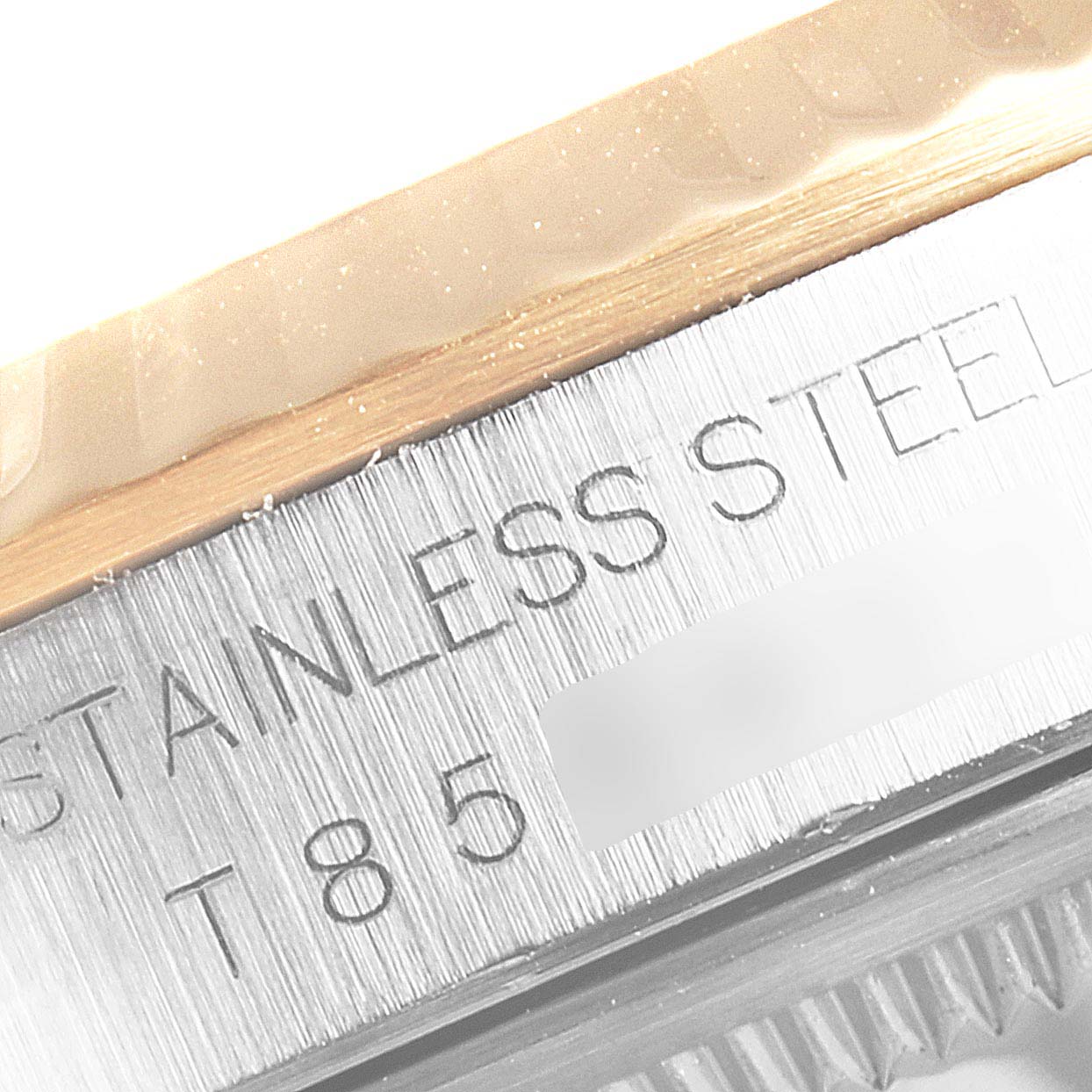 This close-up angle of the Rolex Datejust 16233 Men's Steel and Gold (two tone) Champagne Dial 16233 Men's Steel and Gold (two tone) Champagne Dial model shows the stainless steel part of the watch's case and bezel.