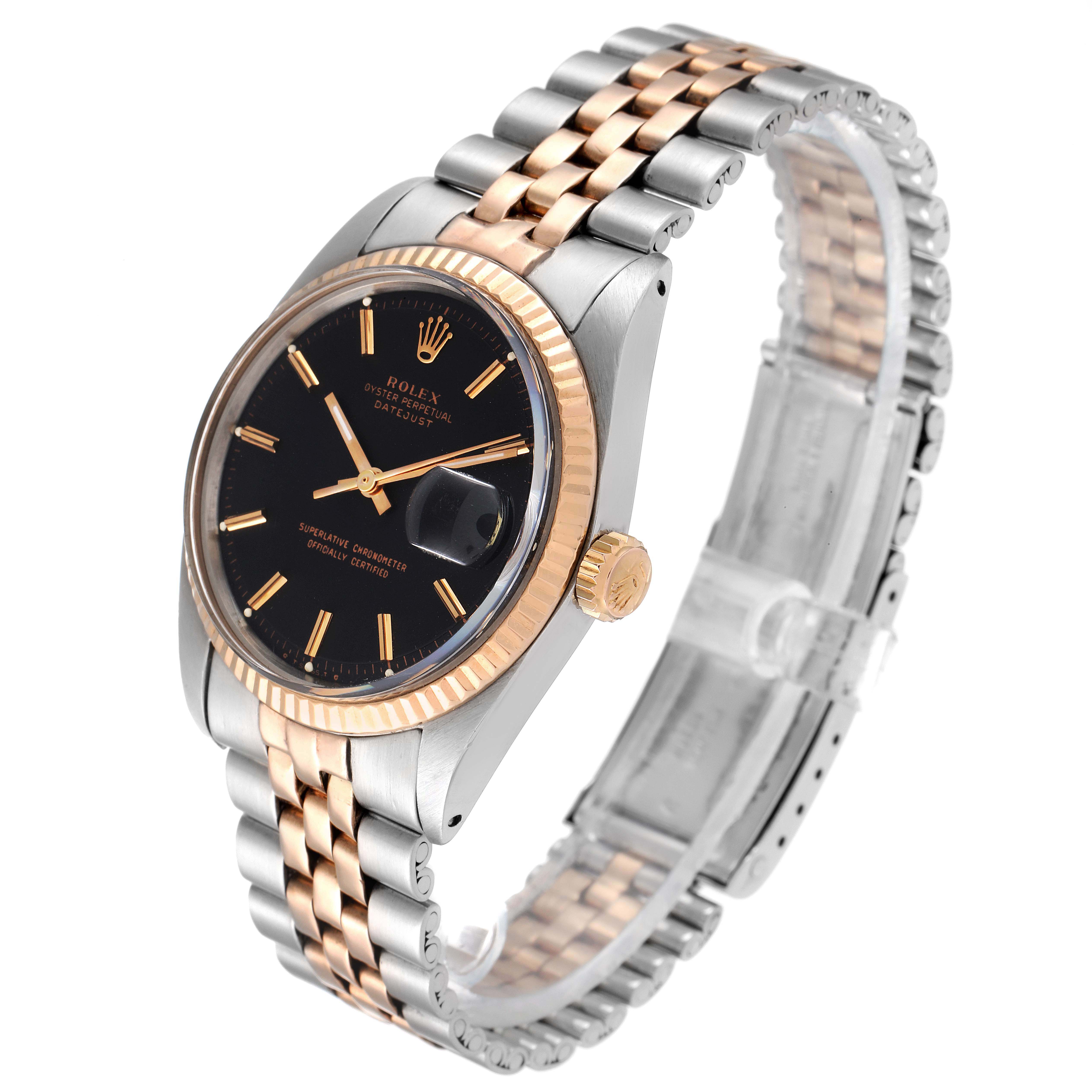 The watch is a Rolex Vintage Collection 1601 Men's Steel and Gold (two tone) Black Dial 1601 Men's Steel and Gold (two tone) Black Dial model, shown at a three-quarter angle, displaying its face, crown, and two-tone bracelet.
