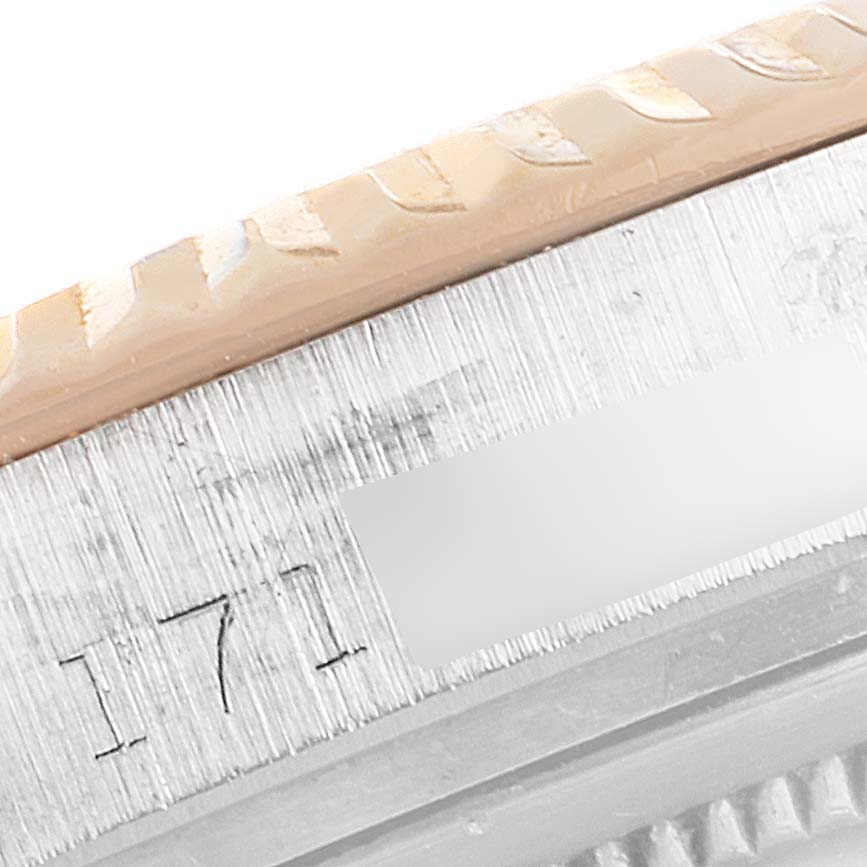 This close-up image shows the detailed engraving and part of the bezel of the Rolex Vintage Collection 1601 Men's Steel and Gold (two tone) Black Dial 1601 Men's Steel and Gold (two tone) Black Dial watch model.