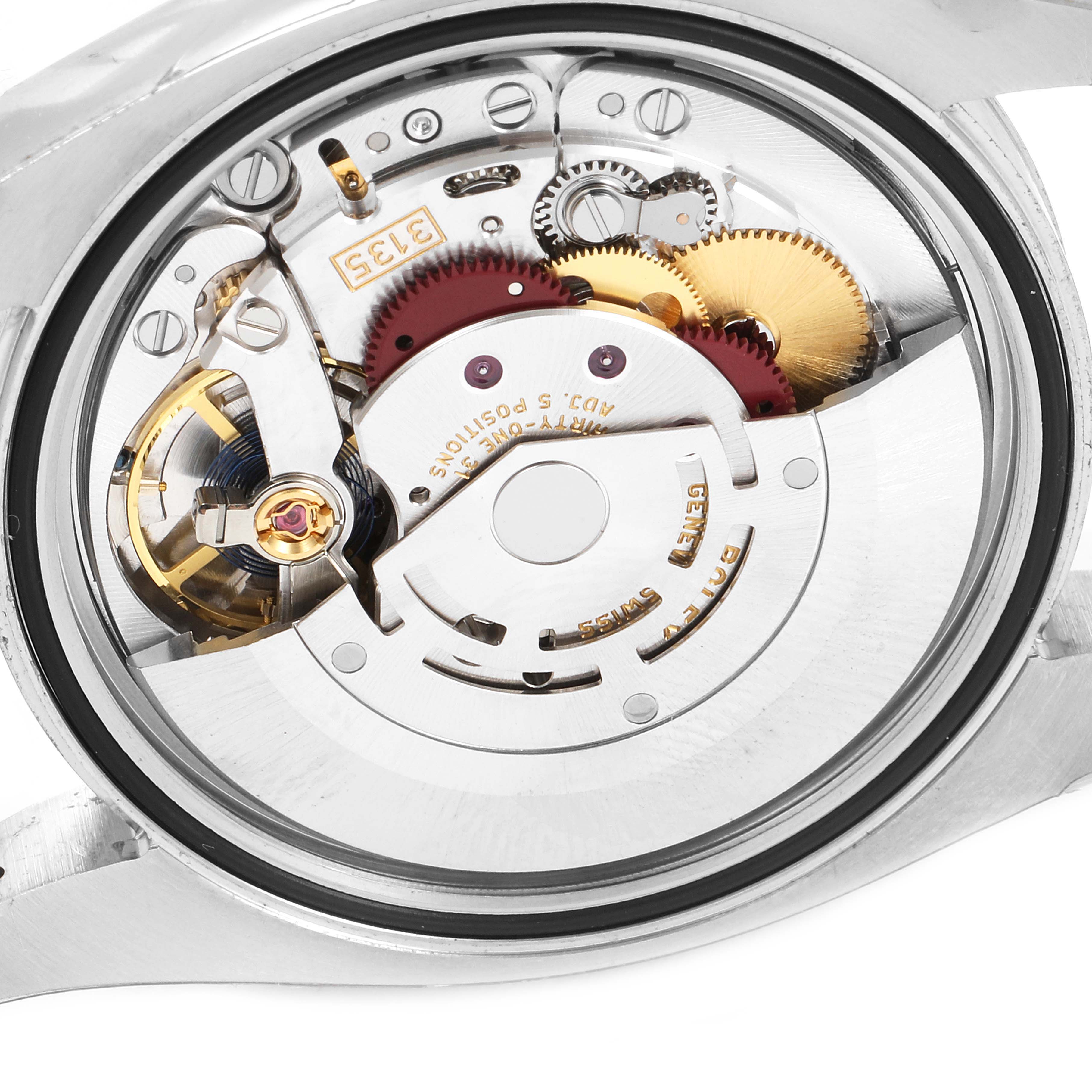 This image shows the intricate movement and mechanical parts of a Rolex Datejust 116234 Men's Stainless Steel Blue Dial 116234 Men's Stainless Steel Blue Dial watch from a rear case angle.