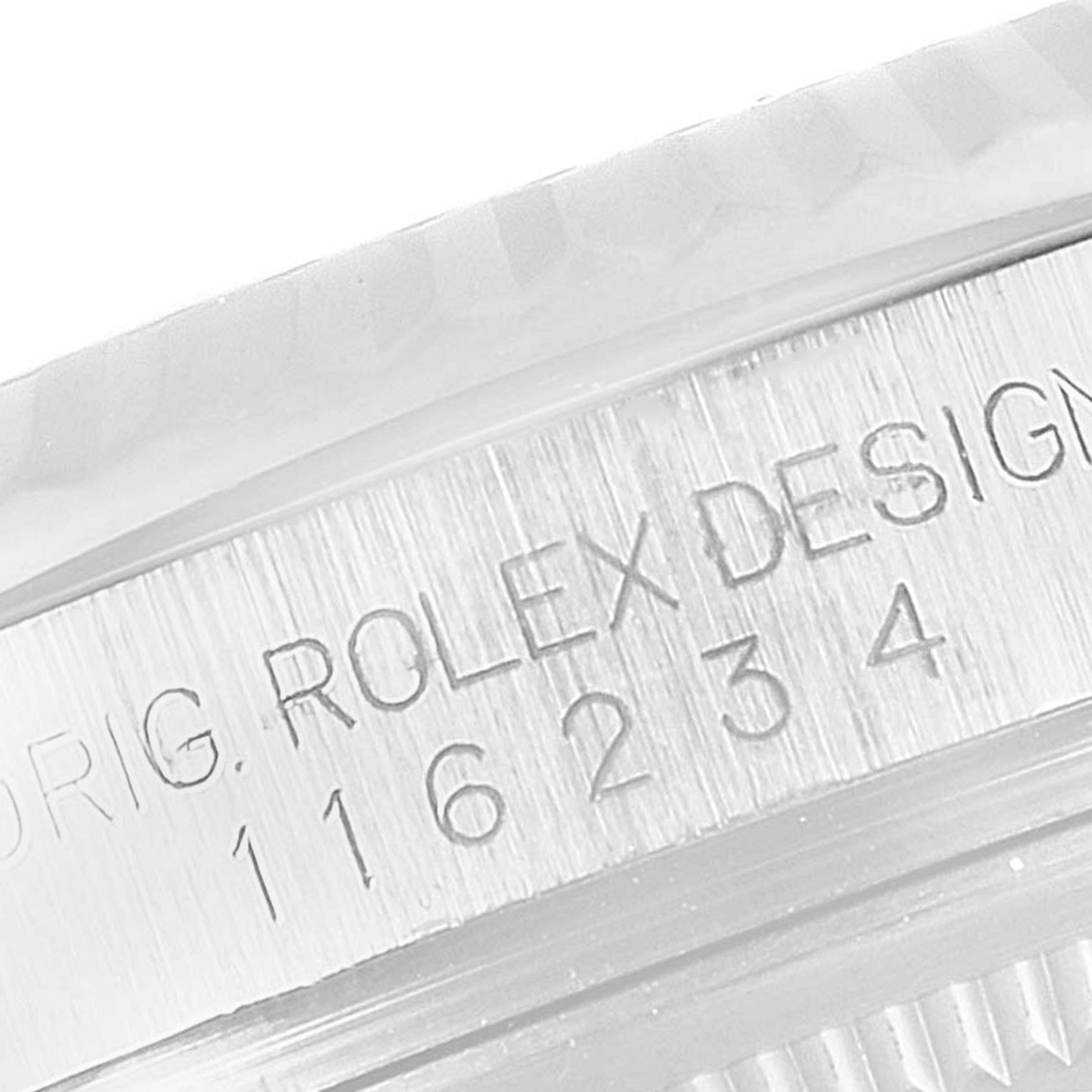 The image shows a close-up of the side view of a Rolex Datejust 116234 Men's Stainless Steel Blue Dial 116234 Men's Stainless Steel Blue Dial model, highlighting the engraved "ROLEX DESIGN 116234".
