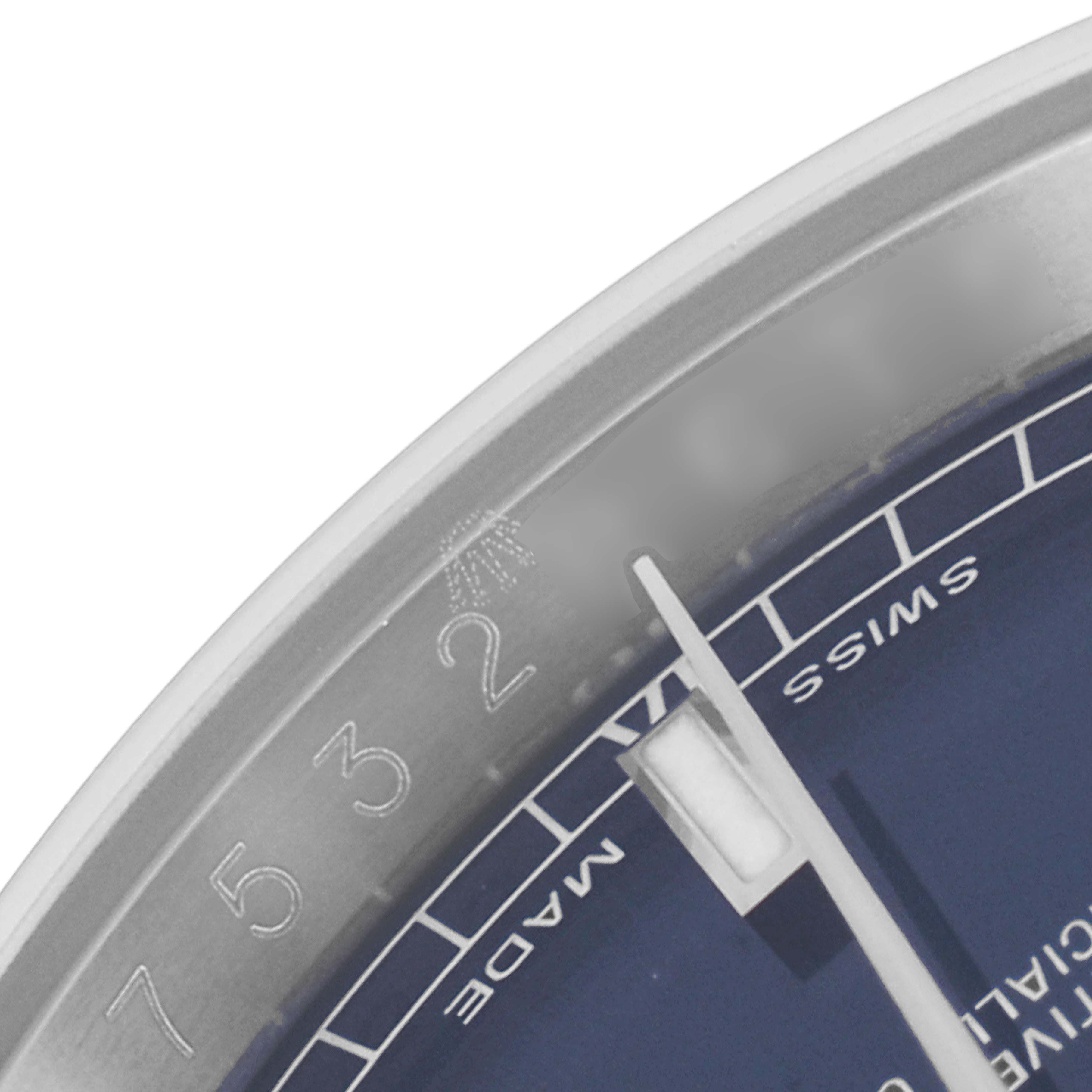 The image shows a close-up of the dial and bezel of the Rolex Datejust 116234 Men's Stainless Steel Blue Dial 116234 Men's Stainless Steel Blue Dial watch, highlighting the numerals and part of the Swiss Made text.