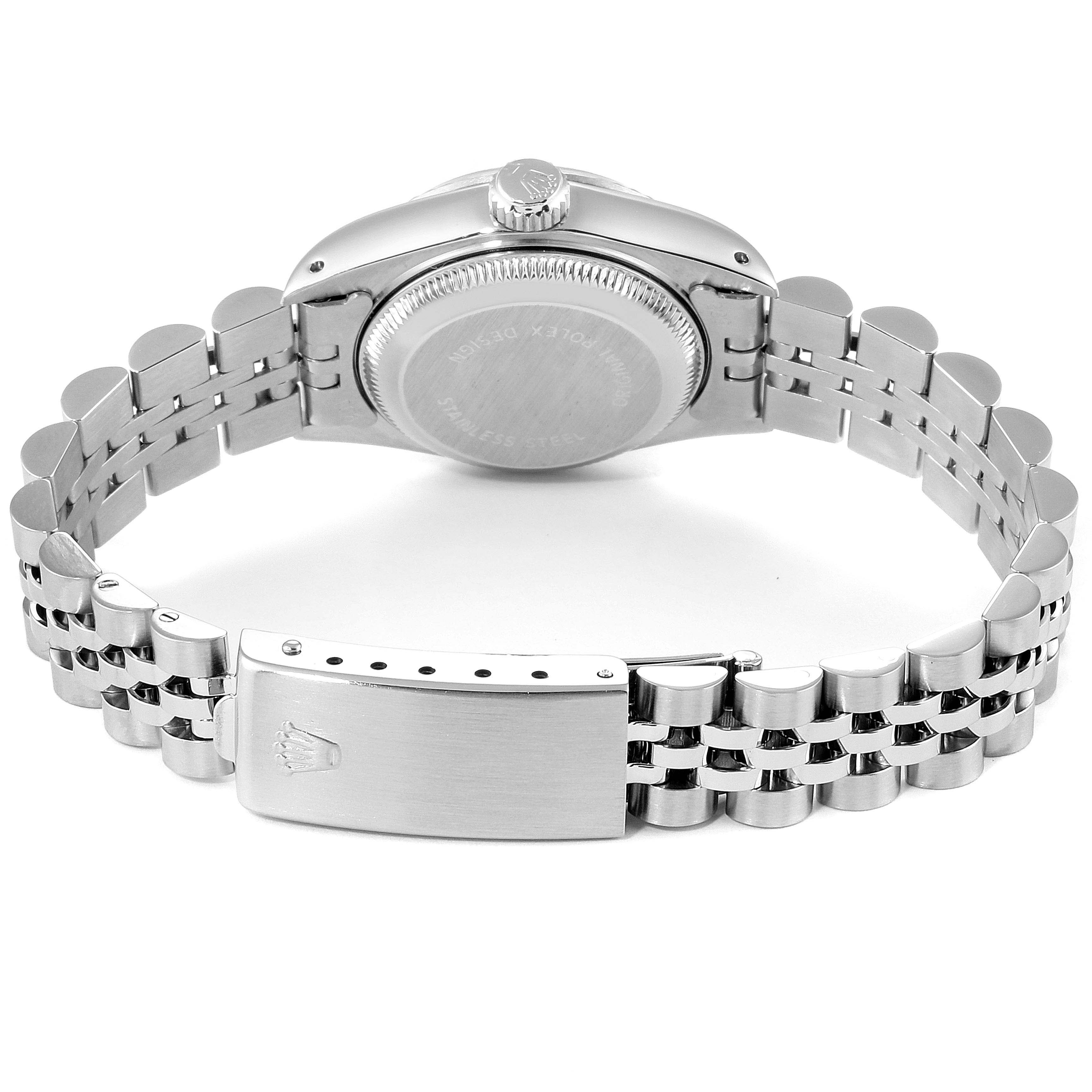 The image shows the back of a Rolex Datejust 69174 Women's Stainless Steel Silver Dial 69174 Women's Stainless Steel Silver Dial watch, including the caseback, crown, and bracelet clasp.
