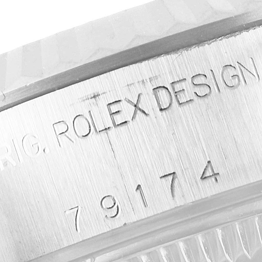 This image shows a close-up of the serial number engraving on the side of a Rolex Datejust 79174 Women
s Stainless Steel Silver Dial 79174 Women
s Stainless Steel Silver Dial watch case.
