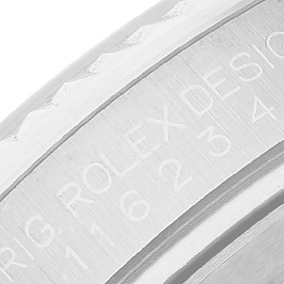 This is a close-up of the engraved bezel of a Rolex Datejust 116234 Men's Stainless Steel White Dial 116234 Men's Stainless Steel White Dial watch.