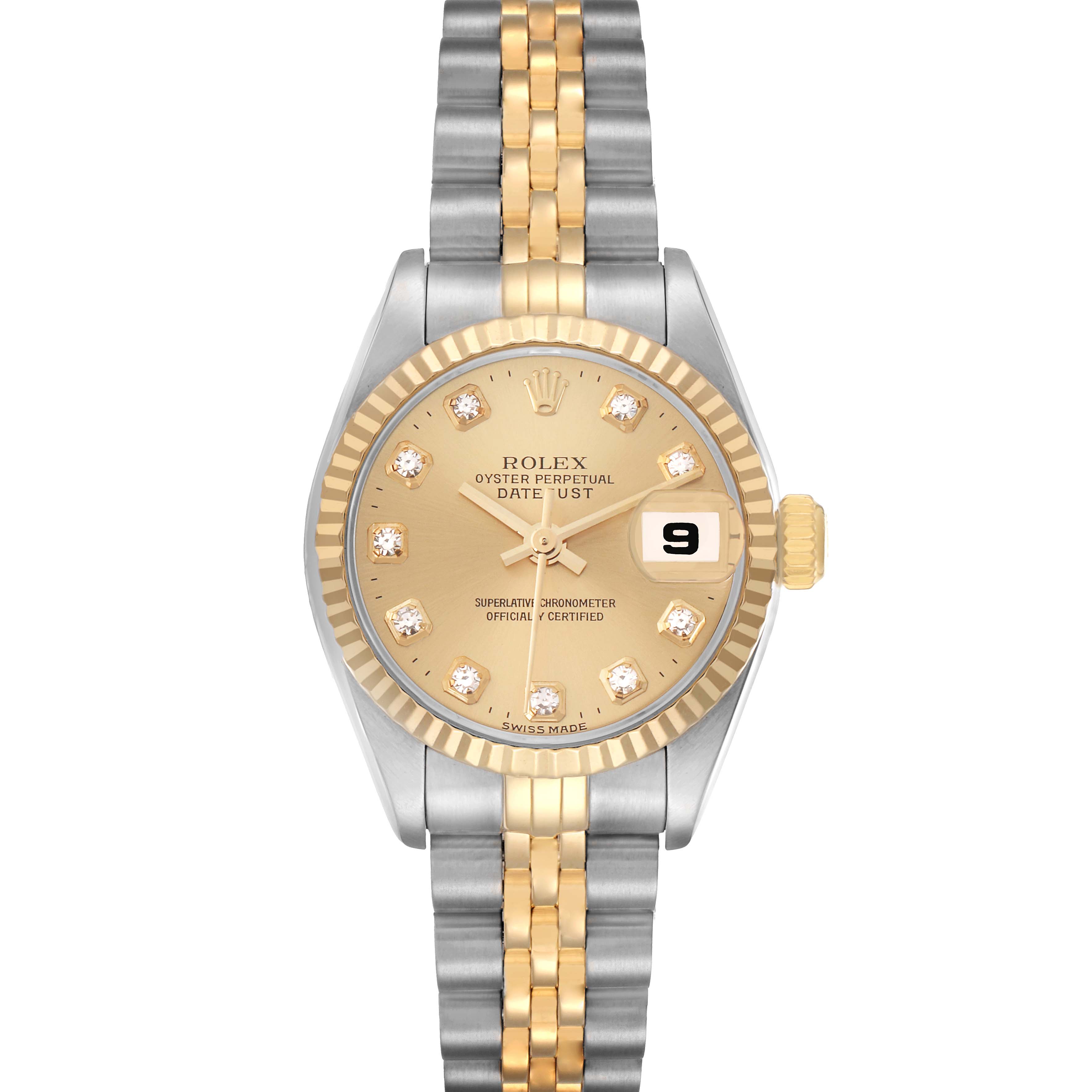 The Rolex Datejust 79173 Women
s Steel and Gold (two tone) Champagne Dial watch is shown from a top-down angle, displaying its gold dial, bezel, and dual-tone bracelet.