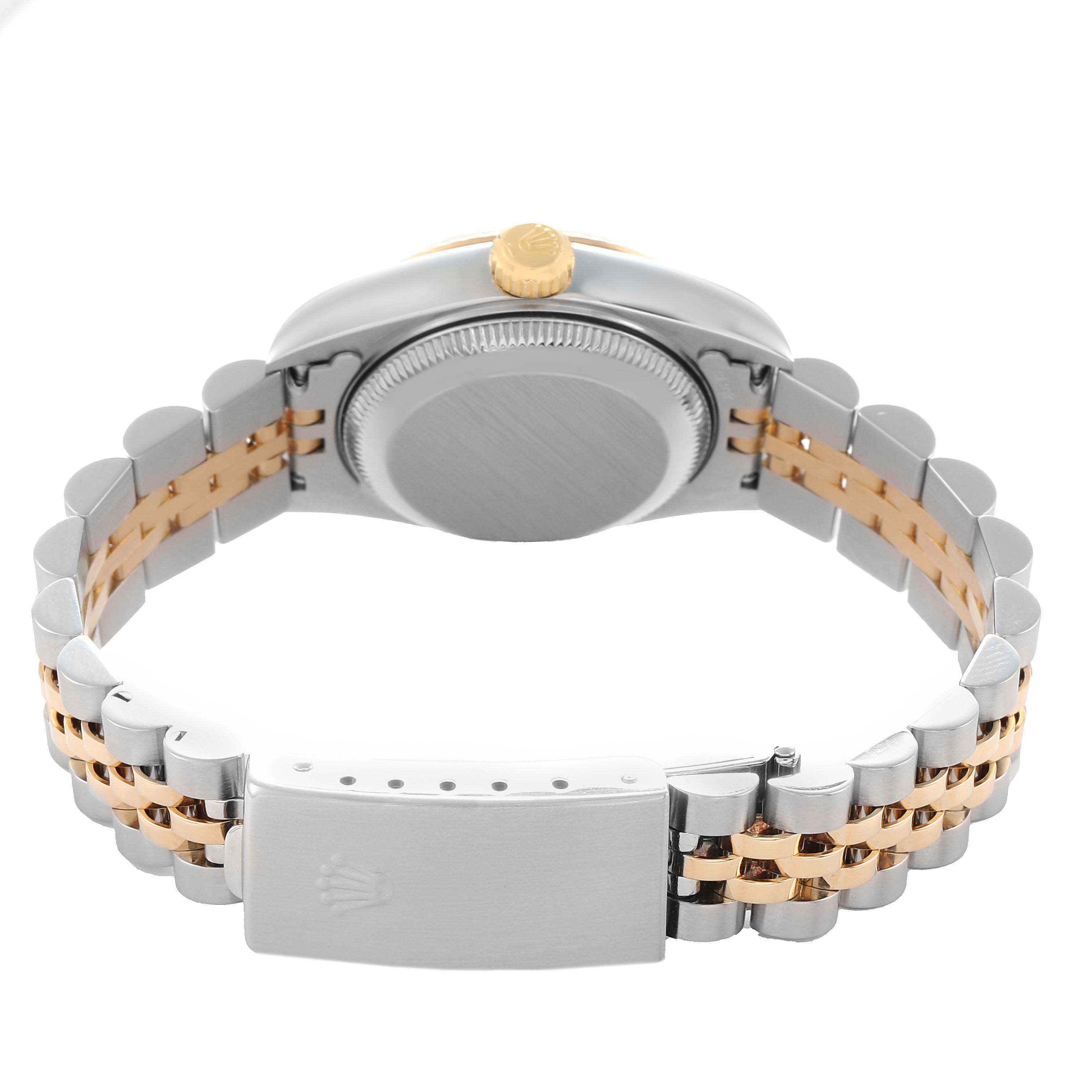 The Rolex Datejust 79173 Women
s Steel and Gold (two tone) Champagne Dial watch is shown from the back, highlighting the case, crown, and two-tone bracelet.