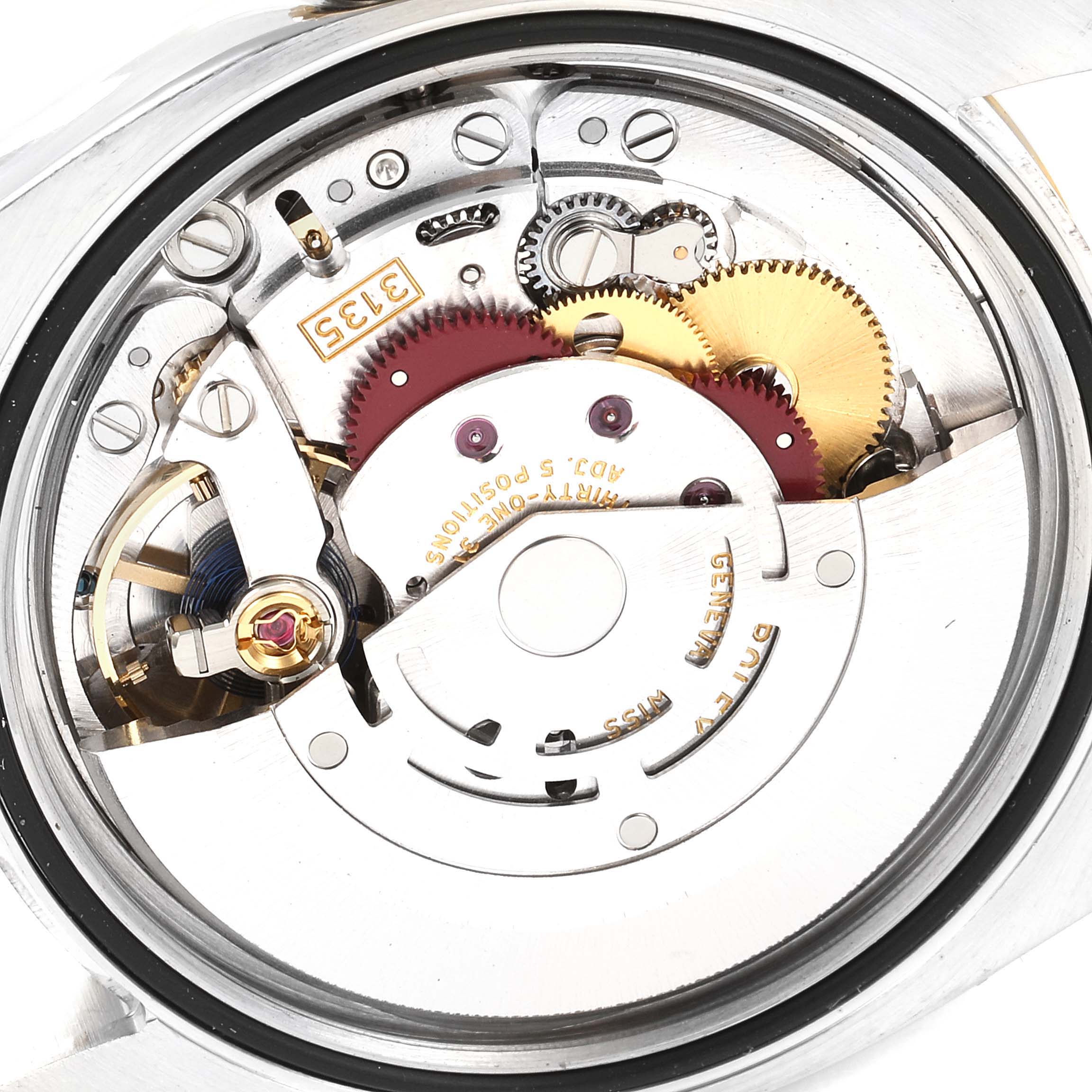 This image shows the internal movement mechanism of a Rolex Datejust 116233 Men's Steel and Gold (two tone) Black Dial 116233 Men's Steel and Gold (two tone) Black Dial watch, viewed from the back.