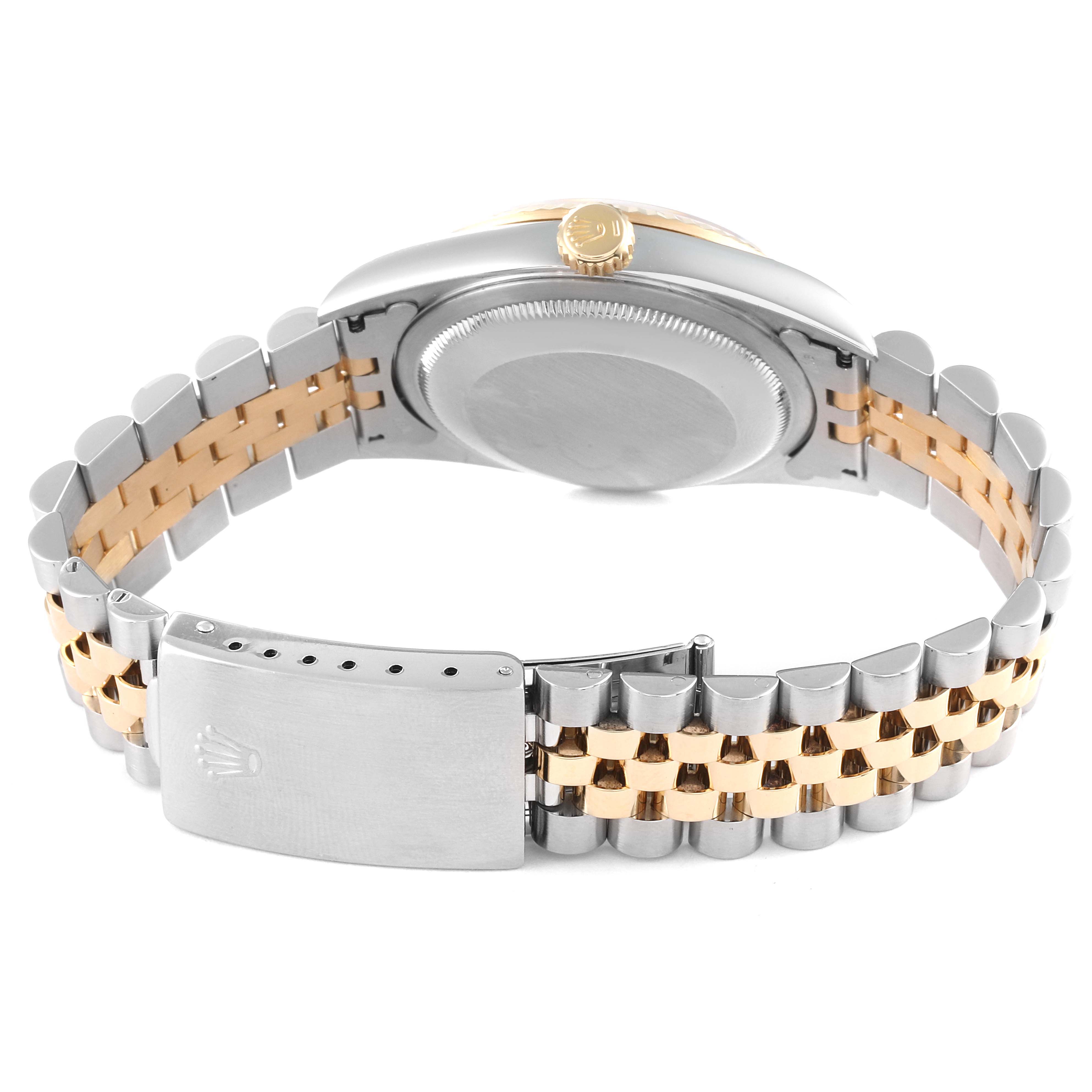 This image shows the back view of a Rolex Datejust 16233 Men's Steel and Gold (two tone) Champagne Dial 16233 Men's Steel and Gold (two tone) Champagne Dial watch, highlighting the case back, crown, and two-tone bracelet with a clasp.