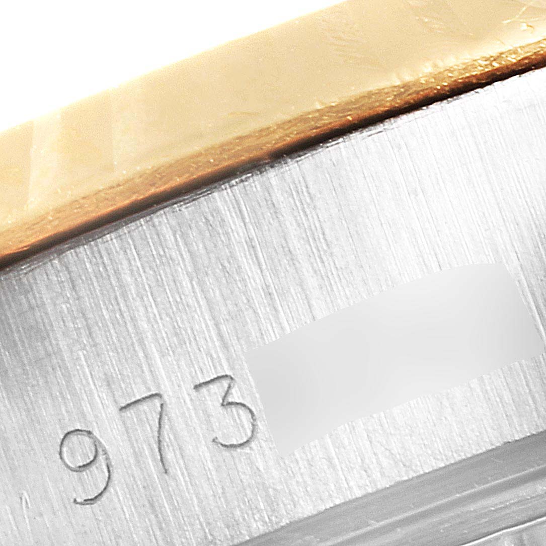 This close-up image shows the serial number engraving on the case side of a Rolex Datejust 69173 Women's Steel and Gold (two tone) Champagne Dial 69173 Women's Steel and Gold (two tone) Champagne Dial watch.