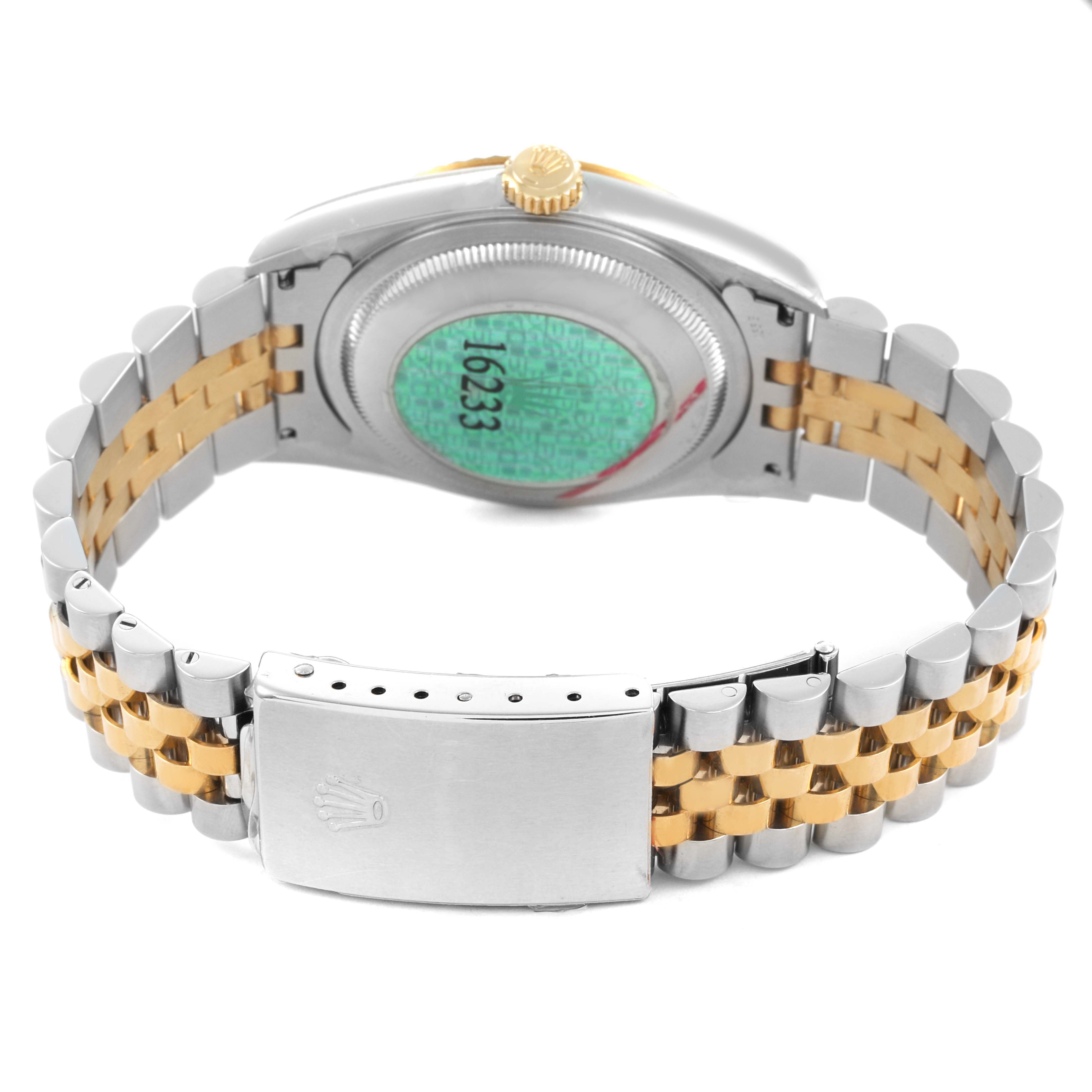 The Rolex Datejust 16233 Men's Steel and Gold (two tone) Silver Dial watch is shown from the back, displaying the bracelet, clasp, and case back.