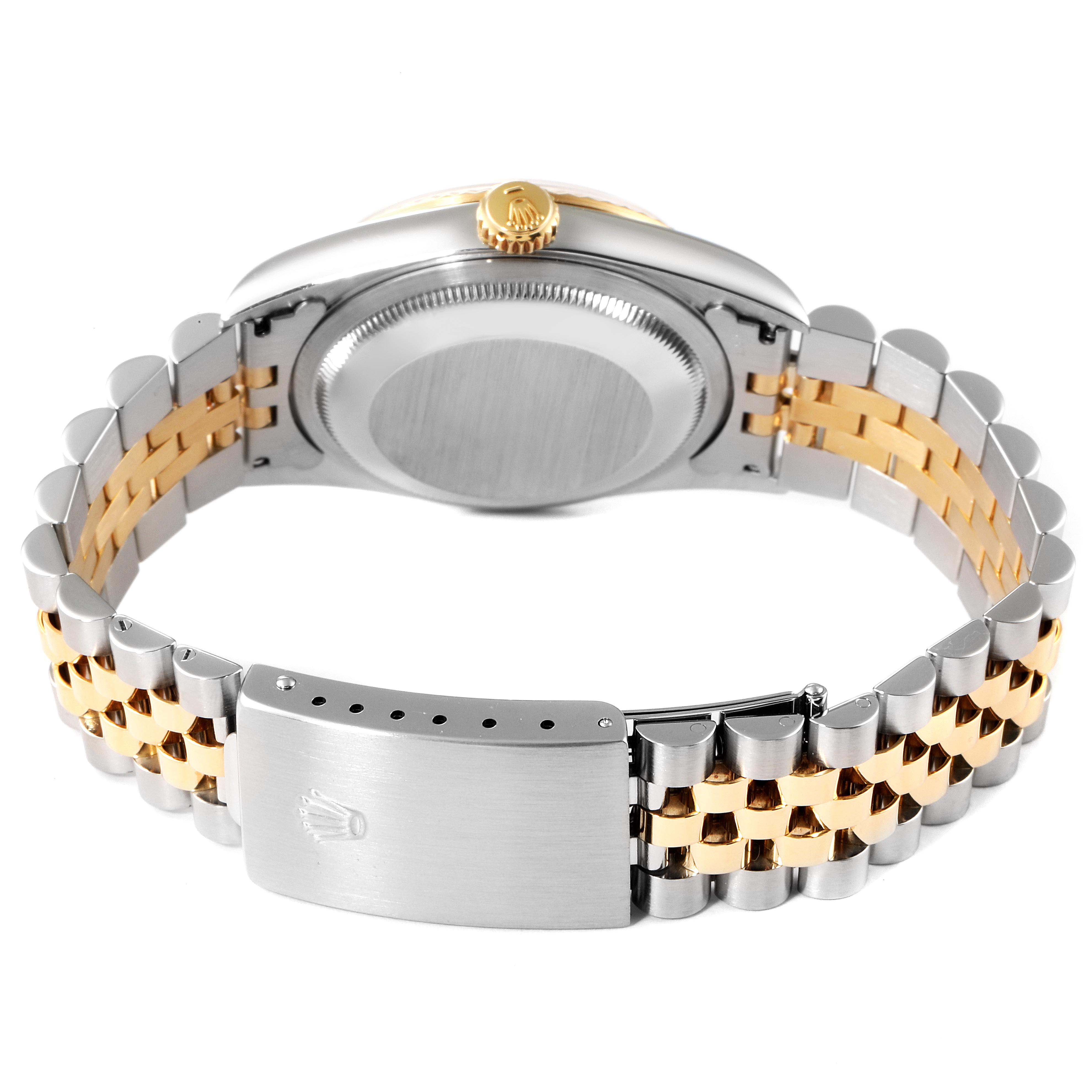 This image shows the back of a Rolex Datejust 16233 Men's Steel and Gold (two tone) White Dial 16233 Men's Steel and Gold (two tone) White Dial watch, emphasizing its clasp, bracelet, and case.