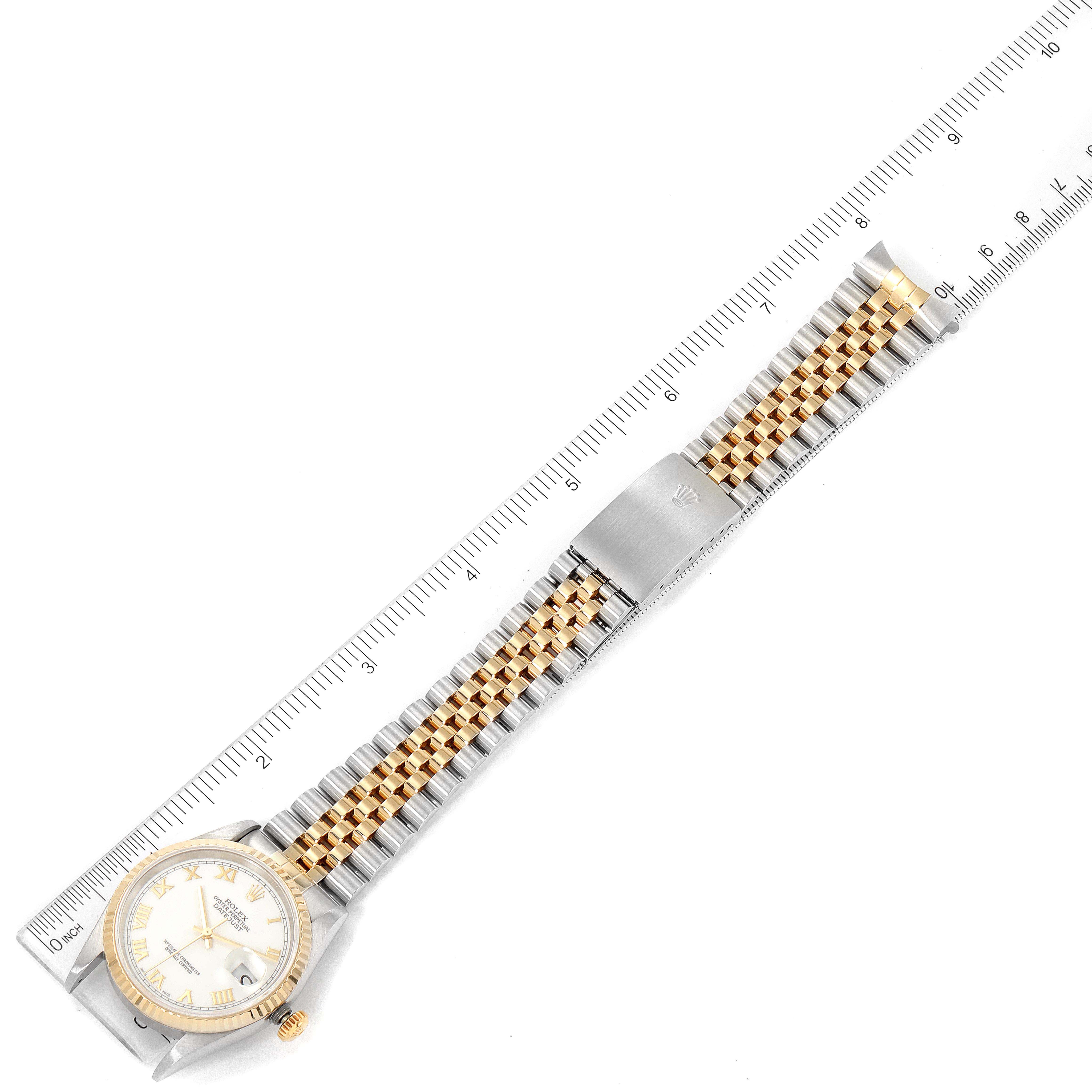 The image shows a top view of a Rolex Datejust 16233 Men's Steel and Gold (two tone) White Dial 16233 Men's Steel and Gold (two tone) White Dial watch, displaying the entire bracelet and clasp, with a ruler for scale.