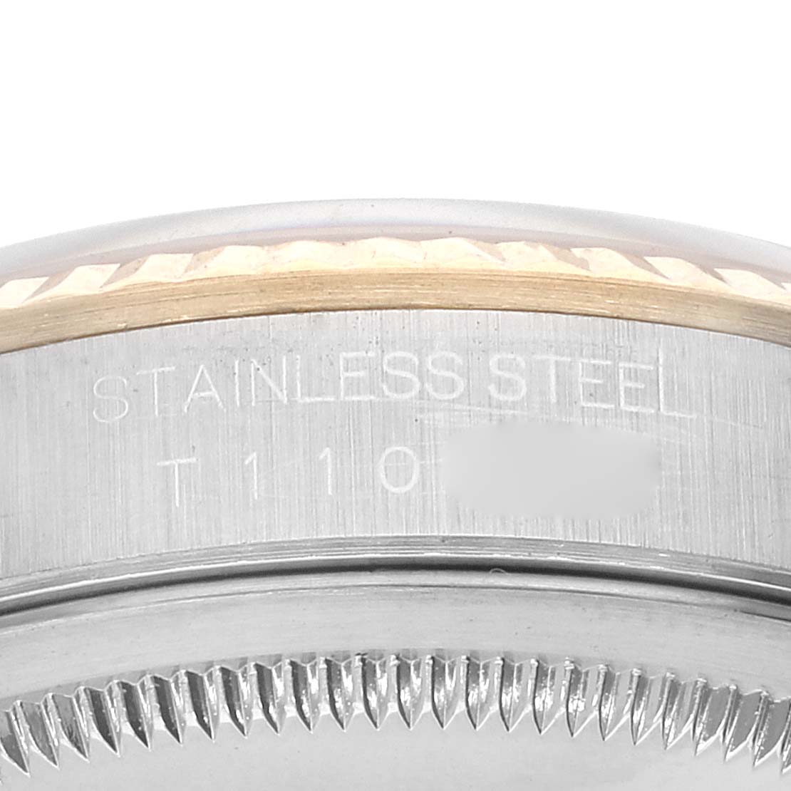 Close-up of the side of a Rolex Datejust 16233 Men's Steel and Gold (two tone) White Dial 16233 Men's Steel and Gold (two tone) White Dial watch, showing the stainless steel case and part of the fluted bezel.