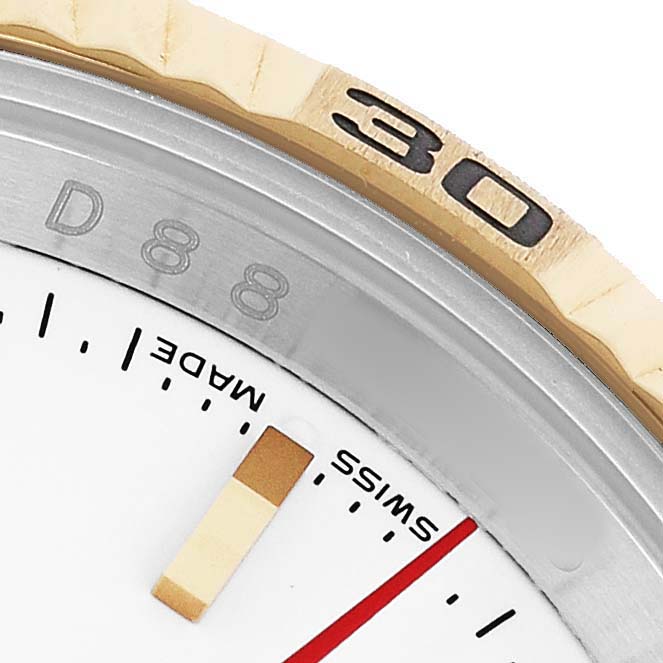 The image shows a close-up of the Rolex Datejust 116263 Men's Stainless Steel White Dial's bezel, part of the dial, and minute markings.