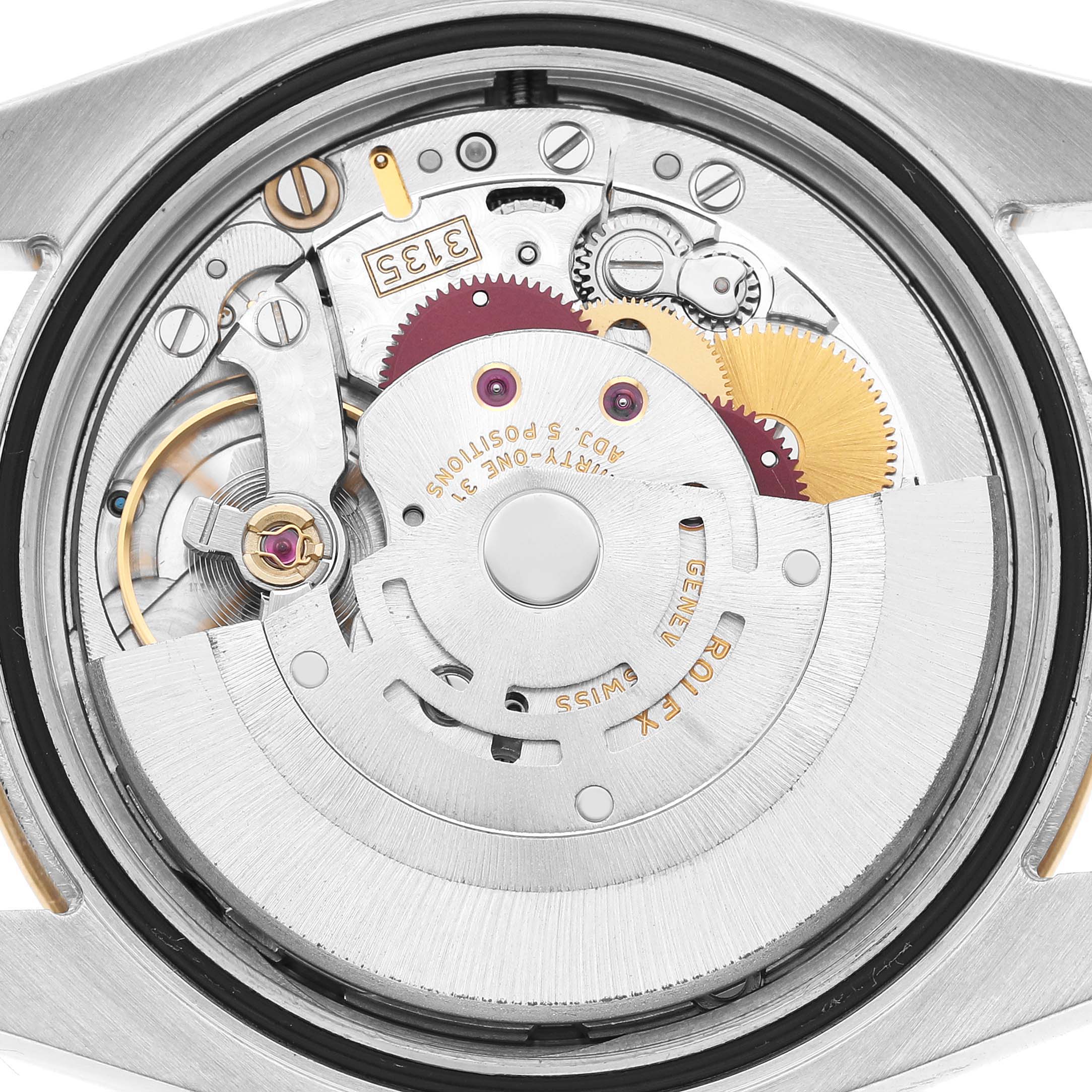 The image shows the movement of a Rolex Datejust 116263 Men's Stainless Steel White Dial watch from a rear angle, highlighting its intricate gears and components.
