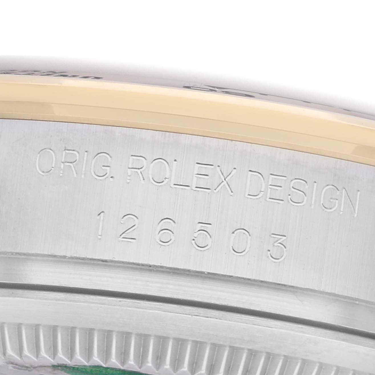 The image shows a close-up of the case side of a Rolex Daytona 126503 Men
s Steel and Gold (two tone) Black Dial, highlighting the engraved model number.