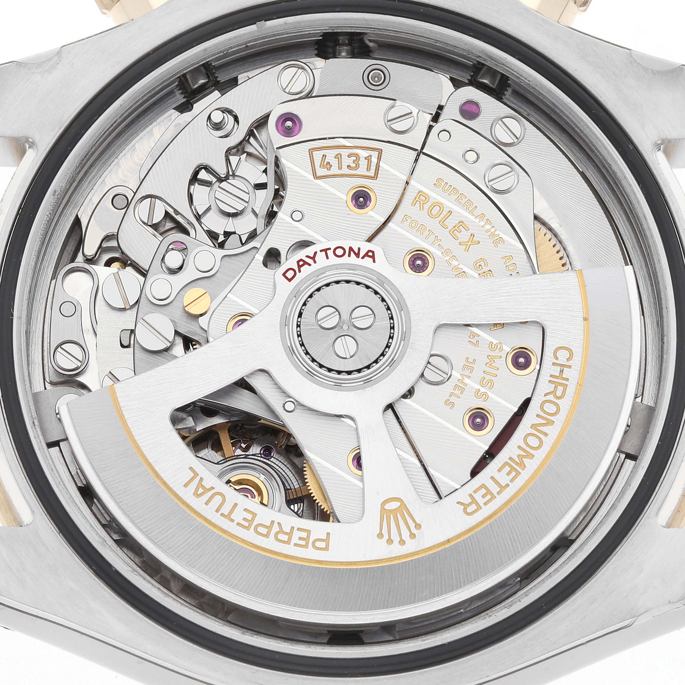 The image shows a close-up view of the Rolex Daytona 126503 Men
s Steel and Gold (two tone) Black Dial watch
s movement, highlighting its intricate components and engravings.