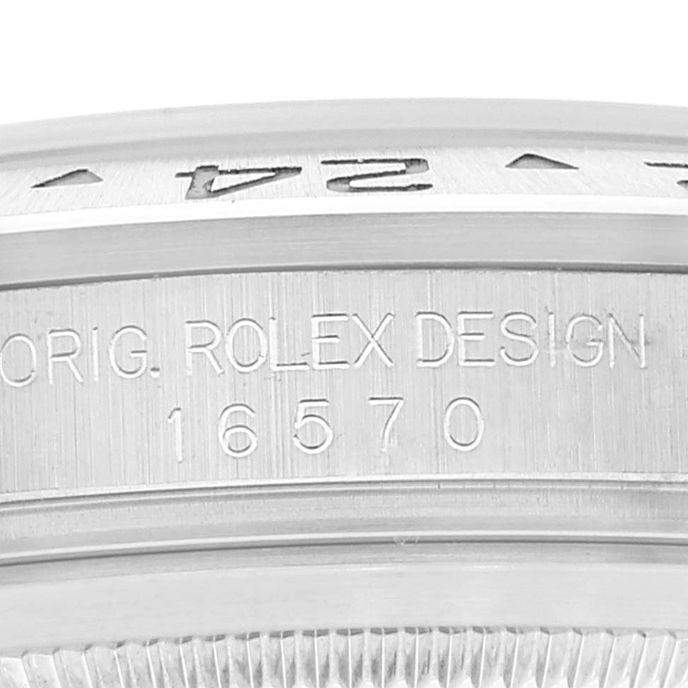 The image shows a close-up of the side engraving on the bezel and case of a Rolex Explorer 16570 Men's Stainless Steel Black Dial 16570 Men's Stainless Steel Black Dial model 16570.