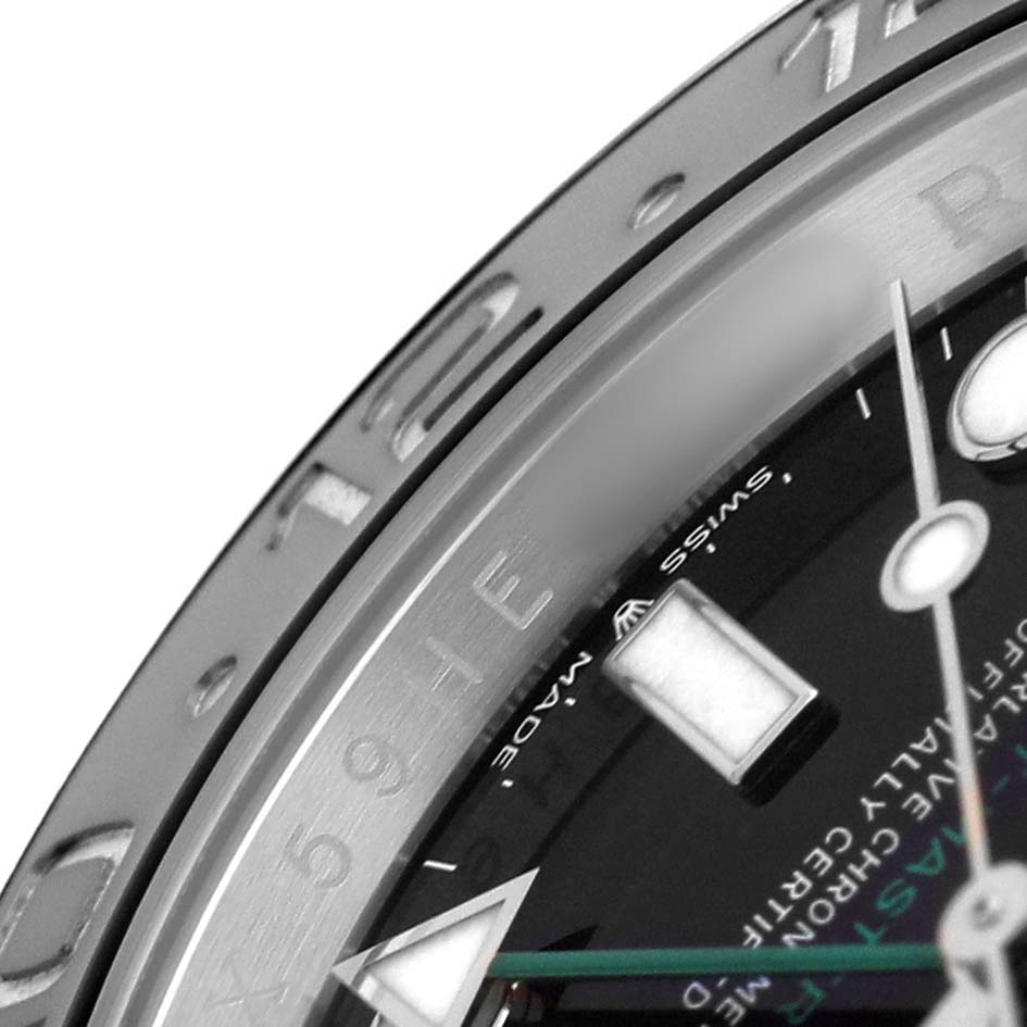 The image shows a close-up of the bezel and dial of a Rolex GMT-Master 126710GRNR Men's Stainless Steel Black Dial, highlighting the indices and partial time markings.